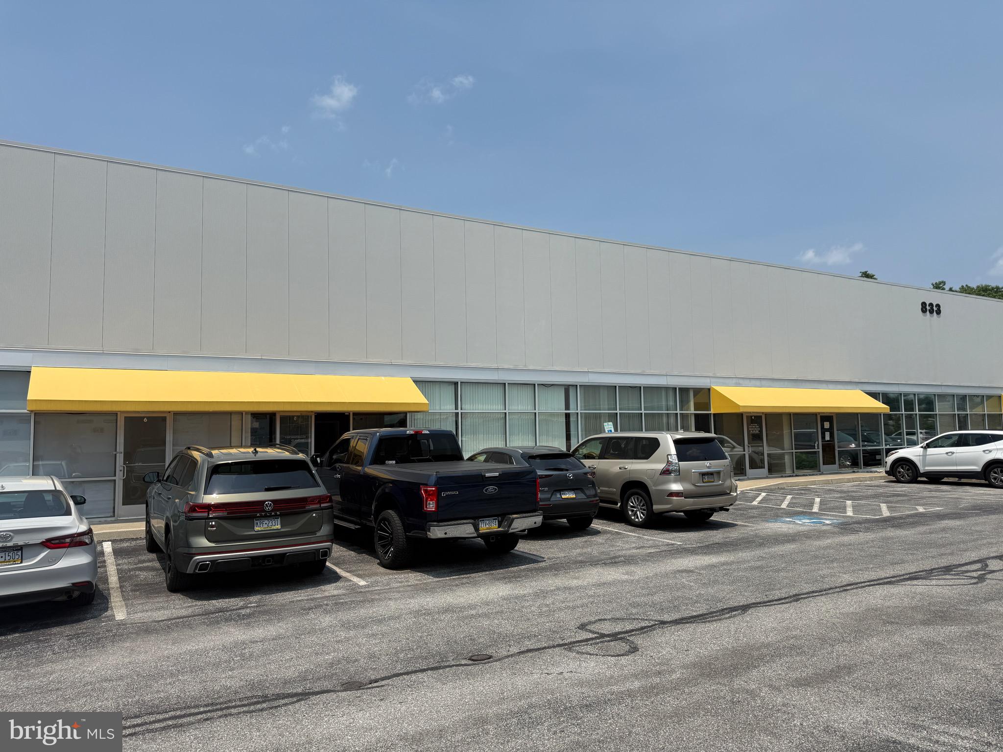 Flex Commercial/Industrial Condo with 2 private offices, a full bath and heated warehouse. Triple Net Lease.
