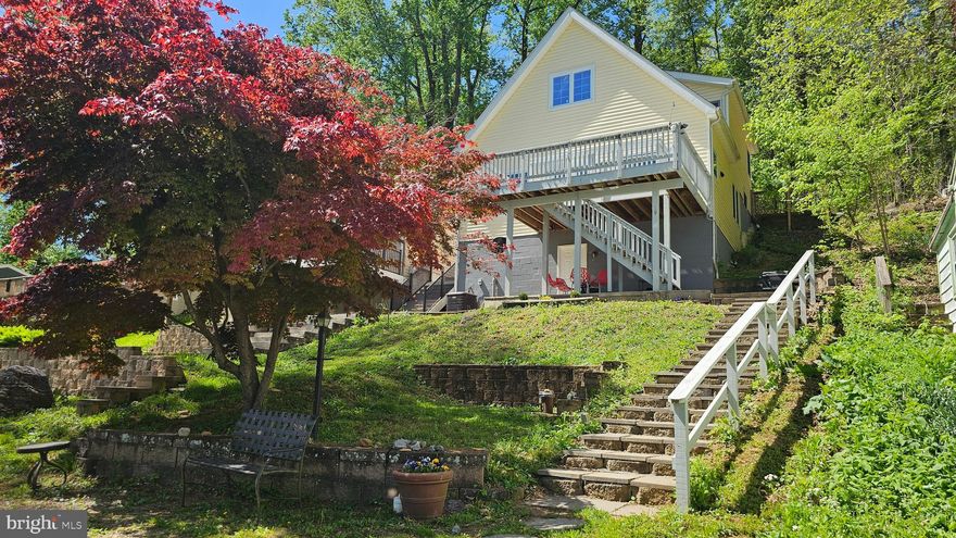 Discover your dream retreat along the banks of the Potomac River in Shepherdstown!  This charming 3-bedroom, 2-bathroom contemporary layout offers an exceptional home and a premium riverfront location with panoramic riverfront views.  The home is well-suited for entertainment with a cozy living room that adjoins the stylish kitchen and separate dining area, with the added convenience of main-floor laundry and a primary bedroom suite.  Both bedrooms on the upper-level provide ample space and enjoy vaulted ceilings with shared access to a large guest bathroom.  

The 0.21 acre property backs to lush trees with a secluded patio and directly fronts the river providing an ideal combination of privacy and awe-inspiring views.  Embrace the outdoor lifestyle with private access to the deep water Potomac River, perfect for boating, fishing, or kayaking.  The property features a single-slip private dock for direct access to .  Located in a vibrant riverfront community with a boat ramp, this home is a rare find for those seeking a peaceful yet active lifestyle.  A new roof was installed in 2023.