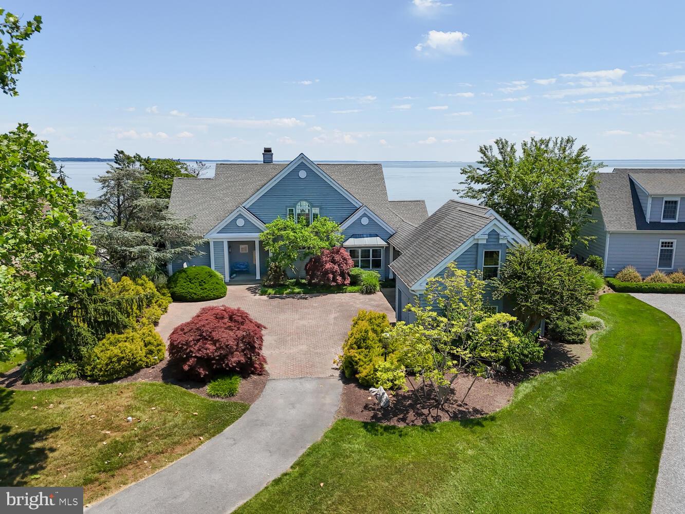 From the moment you step into this custom built home, endless water views will greet you. Open and spacious, with cathedral ceilings in the great room, the rooms are light-filled and airy. Bask in the sun on the 54' deck, or have lunch on the screened porch - so beautiful. There is a large primary suite on the first floor with updated bath as well as one upstairs, so take your pick. The great room features a wood-burning fireplace and built-ins, hardwood floors, and lots of waterside glass. The kitchen is open and has a breakfast area plus a large dining area at the end.
The owners have made many recent improvements, including: the replacement of both zones of heating and air conditioning; crawlspace encapsulation with sump pumps, French drains and a dehumidifier; new flooring in the primary suite and laundry room; new hot water heater; updated powder room with wainscotting and nautical wallpaper.
The lot has been extensively landscaped for privacy and has a large pavered parking area. A breezeway connects the house to the oversized three-car garage with a workbench and an interior staircase to a heated/cooled office above. The shoreline is rip rapped and the house is in the preferred Flood Zone X . Good elevation, flood insurance not mandatory!
Just up the road is the Tilghman on Chesapeake marina, club house and community pool. Boat slips are rented on a seasonal basis and accommodate yachts up to 50' . They are offered at a discounted rate to community residents. Kayak storage is free for residents. This is a fantastic boating and fishing location.
Tilghman is loaded with maritime history and has several nice restaurants to choose from. There are many quiet country roads to bike around. The perfect retreat!
More information about Tilghman on Chesapeake and the marina i on their website. HOA documents are also available there. Annual fees are $800 for common area maintenance and $1495 for the use of the clubhouse, pool, kayak storage.
