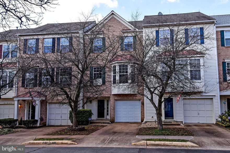 FANTASTIC 3 FINISHED LEVEL BRICK FRONT - 3 BEDROOM & 2 Full and 2 half Baths,  One Car garage TOWNHOME- BACKING TO COMMON AREA AND TREES - FULLY REMODELED THROUGHOUT - GLEAMING HARDWOOD FLOORS ON THE MAIN LEVEL..NEW KITCHEN WITH LARGE BAY WINDOW, NEW STAINLESS STEEL APPLIANCES AND GRANITE COUNTERS.. ENTIRE HOME FRESHLY PAINTINED IN MODERN GRAY... ALL BATH ROOMS UPDATED...BRAND NEW CARPETING ON THE UPPER LEVEL.. LARGE MBR WITH VAULTED CEILING & PRIVATE BATH...BRAND NEW 40 YEAR ROOF... BEAUTIFUL NEW TREX DECK... WINDOWS HAVE BEEN REPLACED...HVAC HAS BEEN REPLACED..NEW LIGHTING AND FIXTURES... BACKS TO TREES AND COMMON AREA.  To apply click here:  https://listing2leasing.com/q.php?q=21945-thompson-square-sterling-va-20166-axggwh