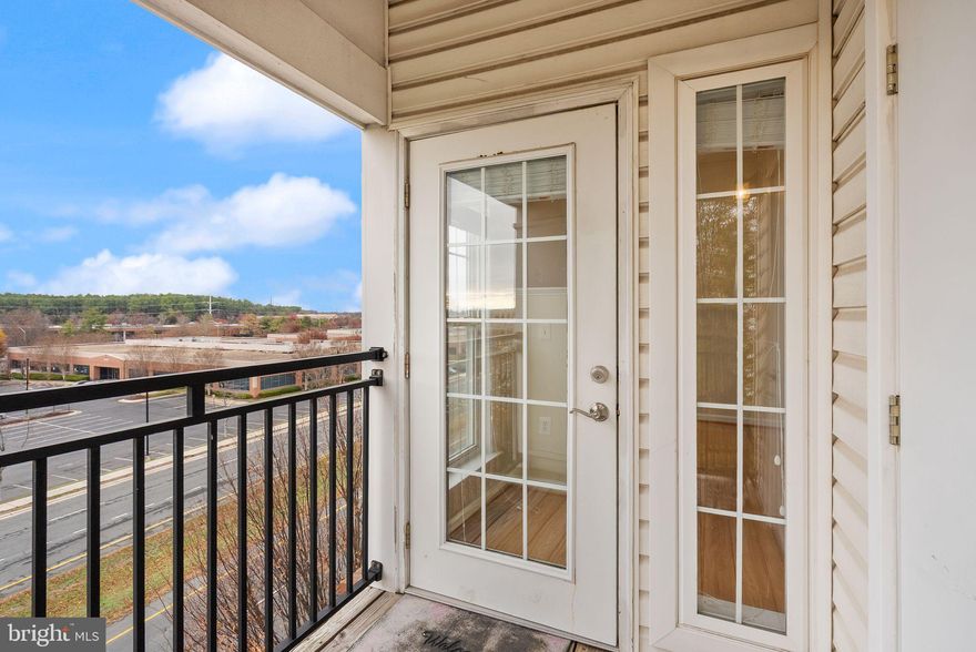 Beautiful 4th-floor, 3-bedroom, 2-bath corner apartment.  Hardwood floors, 10-foot ceilings.  Freshly painted.  Every room (except bathrooms and laundry) have a view.   Loads of light pours in  through floor-to-ceiling windows making the entire apartment awash in sun.  Shades adorn each window.  You'll be amazed at the spaciousness of the bedrooms and the wonderful open living area.  Relax on your balcony off the living room.  Two assigned parking spaces near the door at the 4th floor level  in the attached garage make for secure, convenient access to the apartment.  Great neighborhood with supermarkets, myriad variety of restaurants, and shops  all wtihin walking distance at Sully Plaza and Sully Place.  Convenient to Dulles, Rte 50 , and I-66.  You're going to love this place.  Two-year lease minimum.