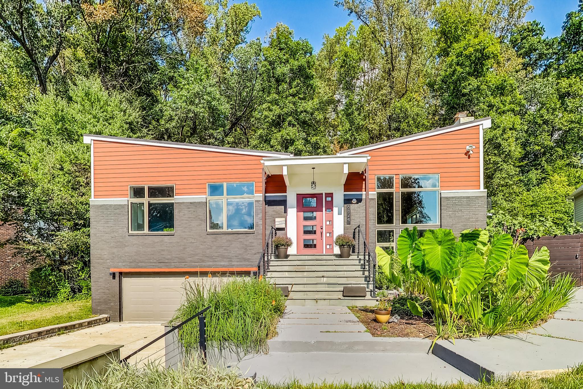 This remarkable residence boasts over 7,200 square feet, including nearly 5,000 square feet of beautifully finished living space, providing ample room for family and guests. The beautifully landscaped front yard features a charming pathway leading to a wide staircase, inviting you into this stunning home.
Upon entering, you are greeted by an impressive foyer with two-story windows that flood the space with natural light, creating a bright and airy ambiance. The open design invites you to look down into the lower level, enhancing the feeling of spaciousness. A sleek metal railing beautifully complements the architectural lines, while a stunning fireplace serves as a focal point, adding warmth and elegance to the entryway.
Flowing seamlessly from the foyer, the main level features high ceilings and expansive living areas. The gorgeous living space overlooks a striking fireplace, creating an inviting atmosphere for relaxation and entertainment. The immaculate kitchen is a chef’s paradise, featuring a spacious island, high-end appliances, dual wall ovens, and a colossal column fridge/freezer, along with a generously sized walk-in pantry. Adjacent to the kitchen, the family room is bathed in natural light, offering three walls of windows, a cozy gas fireplace, and direct access to the expansive deck—perfect for entertaining or unwinding.
The main level also includes a convenient bedroom with an en-suite bath and walk-in closet, along with two additional sizable bedrooms and a stylish full bathroom featuring dual sinks, a separate shower, and a luxurious tub.
As you ascend to the upper level, a spacious sitting area welcomes you, complete with a door leading to a private balcony—ideal for savoring your morning coffee. The luxurious master suite features a generous walk-in closet and a private bathroom with a soaking tub, plus access to another large private balcony. Two additional well-appointed bedrooms, each with walk-in closets and custom shelving, share an updated hall bathroom.
The lower level offers a fun and inviting rec room with soaring 2-story ceilings and a stunning wood-burning fireplace, perfect for cozy evenings. This level also includes a full bathroom, a laundry room, and a storage room, along with access to the 2-car garage. With over 1,000 sq. ft. of high-ceilinged storage space, the possibilities for finishing or additional use are endless.
The property also features a fenced side vegetable garden, perfect for gardening enthusiasts or those looking to enjoy fresh produce right from home.
Located in the highly sought-after Whitman school district, this home offers easy access to River Road, 495, and a variety of restaurants and shopping options. This residence perfectly balances contemporary style and comfort, making it an ideal retreat for any family! Don’t miss your chance to call this exquisite property yours!