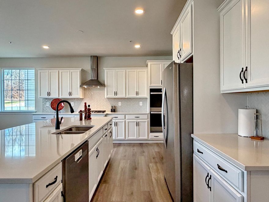 This is a MUST SEE! 
Perfect for multi generational living
Gourmet kitchen with gas cooktop and double ovens
6 ft kitchen island and walk in pantry
Granite counters and custom backsplash
Dual staircase
Main floor bedroom with full bath
Upstairs primary suite with sitting room
Upstairs primary luxury bath with soaking tub and large shower
EVERY bedroom has walk in closet
Two bedrooms share Jack n Jill bath
Upstairs guest room has private bath
Basement walkout level to large open space
Basement rec room and half bath
Basement theater room prewired for surround sound and projector
Basement has 3 pc rough in for ANOTHER full bath

Open Concept Design between the Family Room, Kitchen & Grand Foyer with Tray Ceiling & Dual Access Staircase from Foyer and Kitchen.  Why wait for new construction??  Mid Atlantic Builders Sorrento 2.0 home 2 years young! 5 bedrooms with 4 full baths and 2 half baths. PLUS rougn-in for additional full bath on lower level. Main Level Bedroom Suite with Full Bath & Walk-In-Closet, Upper level-Luxurious Primary Suite with a Sitting Area, Oversized Large Walk-In Closet & a Grand Bath Suite.  Over 5,200 square feet finished space, this home is designed for those who appreciate the finer things in life, providing an exclusive lifestyle that is both inviting and sophisticated. As you step inside, you are greeted by a warm ambiance that flows throughout the open-concept living spaces. The heart of the home features a stunning gas/electric fireplace with glass doors, creating a cozy focal point for gatherings or quiet evenings at home. The thoughtfully designed layout includes five spacious bedrooms with walk in closets, four luxurious full bathrooms and two half baths, ensuring ample space for relaxation and privacy. Finished Lower Level Walkout Rec Room, Theater Room & Powder Room as well as a rough-in for full bath. The finished basement areas, offer endless possibilities-whether it be a gym, or additional living space. Nestled in the prestigious Villages of Savannah, this exquisite Colonial-style residence, built in 2024, offers a harmonious blend of elegance and modern comfort. The meticulous attention to detail is evident in every corner, from the high-quality frame, brick, and stone construction to the elegant finishes that adorn each room. The seamless flow from the kitchen to the dining and living areas enhances the sense of connection and warmth throughout the home. Outside, the property boasts an attached two-car garage, providing convenience and security. The surrounding community offers a wealth of amenities and recreational opportunities, allowing residents to enjoy an active and vibrant lifestyle. This residence is not just a home; it is a sanctuary where luxury meets comfort. With its prime location in the Villages of Savannah, you will find yourself immersed in a community that values quality living and a sense of belonging. Experience the perfect blend of modern elegance and timeless charm in this exceptional property, where every detail has been thoughtfully curated to create a truly remarkable living experience. Embrace the lifestyle you deserve in this stunning Colonial masterpiece.