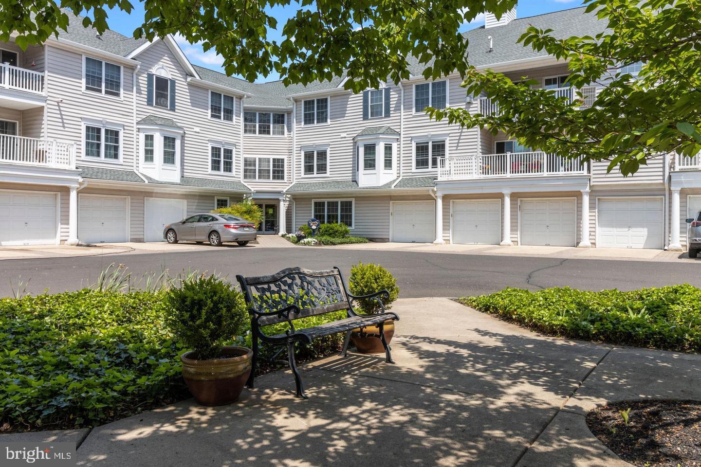 Sought after Yardley Point - Privately located "on the hill" on over 5 acres all in YARDLEY BORO- walk to restaurants, shopping along with a walk on the canal or the Delaware River, and you can walk to the Yardley Country Club for golf. This Sun-drenched light and bright 3rd floor pristine unit in this active 55+ community. 2 bedrooms plus a separate office or bedroom area as well and 2 full bathrooms and a fireplace as well. Open floor plan and this unit gets tons of light. Take a walk on the trail from Yardley Point leading to Main Street for shops, restaurants, coffee and so much that Yardley has to offer. Neutral paint, carpeting and tile. A deep one car garage provides security with inside access to the building with ample storage. There is additional space set aside for storage on each floor and there are adequate closets as well in this beautiful unit. A large balcony is off the dining area and accessed by sliders from the dining room and the living room. There is a common area as well as a work out room and an elevator for ease of access for home owners. Water, Sewer, Trash, Security, Intercom and exterior maintenance along with snow removal are included. Easy To Show!!!!!