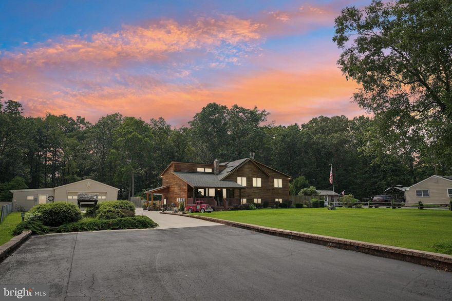 EVERYTHING YOU WANT AND MORE!  Beautiful custom-built, 3-4 bedroom, 2 full bath, and 2 half bath home on approximately one acre offering plenty of outstanding features for your comfort, convenience, and entertainment. These sellers thought of everything when they built this home!  As you approach the home, you will be impressed with the beauty of the exterior and the meticulous landscaping.  Plenty of parking as the paved driveway opens up to a double and triple concrete driveway which leads to a stone driveway with even more parking to accommodate any large gatherings, as this home is perfect for entertaining!  Head to the back yard where you will find your own oasis with a perfectly designed inground gunite swimming pool surrounded by extra concrete and a screened pool house equipped with a half bath, sink, and refrigerator to complete this backyard getaway!  As you enter the front of the home, you will see the formal living room with vaulted ceiling to the left and steps up to a formal dining room and kitchen.  Head down the hall to the primary bedroom with vaulted ceiling, bamboo wood flooring, full ensuite bath, and sliding doors leading to the Trex deck spanning the length of the home and overlooking the beautiful view of nature and your own peaceful sanctuary inviting you to cool off on those hot summer days! The upstairs is compete with 2 more bedrooms and another full bath.  Now head downstairs for another whole level of living space, including a large family room with woodstove, spacious dining room, half bath with laundry, and another complete full kitchen!  This level also has 2 sets of sliding doors leading to the patio and pool area.  Take a few steps down to one more level featuring an office/flex area or 4th bedroom with walk-in closet for more storage.   Other special features of this home include a brand new water heater (May 2025), newer roof, heater and AC (all approx. 10-11 years old), central vacuum, sprinkler system, and solar panels to produce those extra low electric bills.  Back outside, you will find a detached 2-car garage connected to a spacious workshop and a large storage shed, all with electric. WHAT MORE COULD YOU ASK FOR??  Click on the 3D Video Tour to see more!  Call to schedule your private showing today!