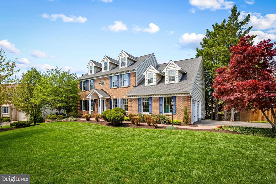 Welcome to 5106 Crystal Park Lane, a stunning brick-front colonial tucked away on a quiet cul-de-sac in Crystal Springs Estates. This impressive home greets you with an inviting two-story foyer and sets the tone with rich hardwood flooring, on-trend paint colors and 9’ ceilings throughout the main level.  The remodeled kitchen is a true centerpiece, featuring on-trend white cabinetry, quartz countertops, a massive island with elegant pendant lighting, and upgraded stainless steel appliances, including a commercial-grade gas range. A sunny breakfast area opens seamlessly to the spacious family room, where custom built-ins frame a cozy wood-burning fireplace..  Formal living and dining rooms offer classic charm with crown molding and chair rail detailing. A convenient mudroom off the garage includes main-level laundry, adding everyday functionality. Upstairs, you’ll find four generously sized bedrooms and two full bathrooms. The primary suite is a relaxing retreat with cathedral ceilings, a separate sitting area, a walk-in closet plus an additional double closet. The en-suite bath features a double sink/vanity, jetted soaking tub, and separate shower. Three additional bedrooms showcase upgraded luxury vinyl plank flooring and share a beautifully renovated hall bath with quartz countertops and a custom tile shower. The finished walk-out lower level provides exceptional flexibility, offering a large recreation room with space for both relaxing and gaming, a potential fifth bedroom and full bath ideal for guests, and a private office perfect for working from home. Outdoor living is just as impressive, with a two-tier, low-maintenance deck and a spacious stone patio complete with a fire pit—ideal for entertaining or unwinding in a peaceful setting. This home is ideally located in Ellicott City near shopping, recreation and major commuter routes.
