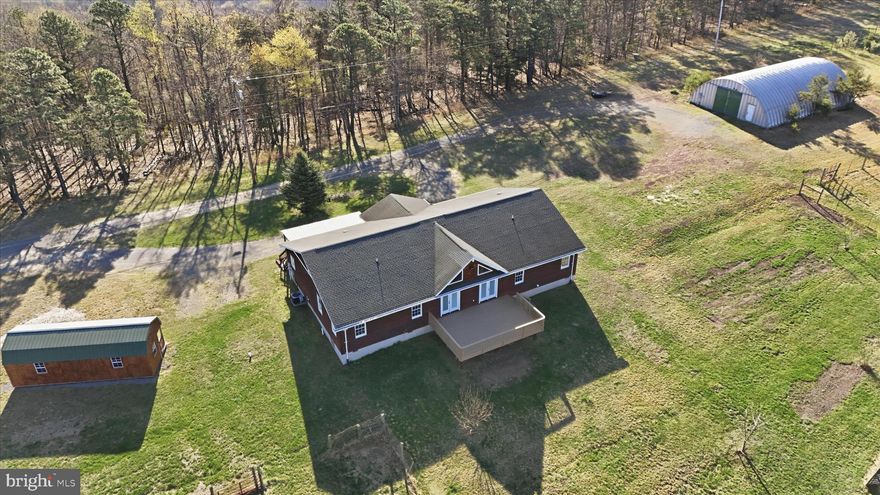 Set on 20 unrestricted acres with stunning mountain views, this one-of-a-kind property offers the perfect blend of privacy, space, and convenience. Whether you’re dreaming of a small farm, hunting retreat, or peaceful homestead, this property delivers.
The home features 5 bedrooms, including a massive primary suite tucked away in its own private wing. This retreat offers a spacious walk-in closet and a cozy office nook—ideal for working from home or unwinding in your own quiet space.
Step outside and enjoy everything the land has to offer: mature apple and pear trees, a hunting stand, and plenty of open space for chickens, goats, or gardening. Outbuildings include a quonset hut with electric and a large shed with electric and double doors, giving you ample room for equipment, hobbies, or storage.
Enjoy the seclusion and wide-open feel of country living while still being just minutes from restaurants, grocery stores, and everyday amenities.
This is a rare opportunity to own versatile, unrestricted land with endless possibilities