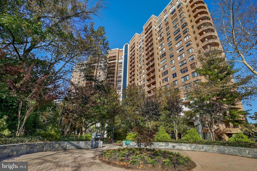 Hardwood floors throughout... even in the bedroom! Balcony tucked in behind flowering trees & treetops. Open kitchen with tons of counter space & storage. In unit washer/dryer. Awesome building with exceptional management/front desk attendant, gym, business center, elegant lobby, movie room & pool. Walk to Grosvenor Metro & Grosvenor Market. Lovely Grounds with walking path. Trails/parks close by.