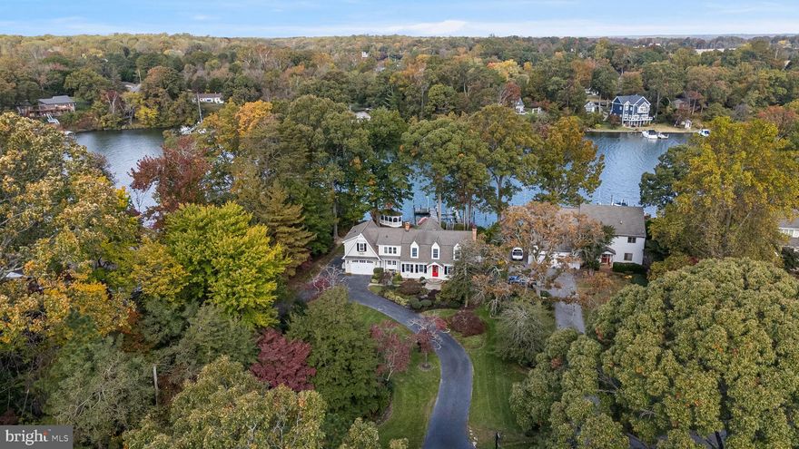 Welcome to a luxuriously crafted waterfront home where design and comfort meet the tranquility of coastal living. Perfectly positioned to capture sweeping views of Cuckold Creek, this residence showcases exceptional finishes and attention to detail throughout. The Hardie board exterior, accented by lush landscaping and a charming gazebo overlooking the shoreline and pier, evokes a timeless Dutch Colonial aesthetic with modern coastal flair.

Step inside and experience luxury and scenic water views at every turn — from the stunning owner’s suite to the showstopping kitchen featuring top-of-the-line appliances, including a Miele coffee system, and beautifully detailed cabinetry. The inviting living and dining spaces provide the perfect backdrop for entertaining or relaxing fireside while taking in the water views. Enjoy the convenience of TWO laundry rooms, one postured conveniently in the owner's suite and on the lowest level. 

Outside, your waterfront lifestyle continues with an impressive pier setup that includes a dock building equipped with an ice machine, refrigerator, and fish-cleaning station — plus power, water, and an outdoor shower. A 20,000 lb. boat lift makes accessing the open water effortless.

With space available to add a detached garage or pool, this property offers both refined living and room to grow. Come experience the unmatched beauty, craftsmanship, and serenity of this one-of-a-kind waterfront home.