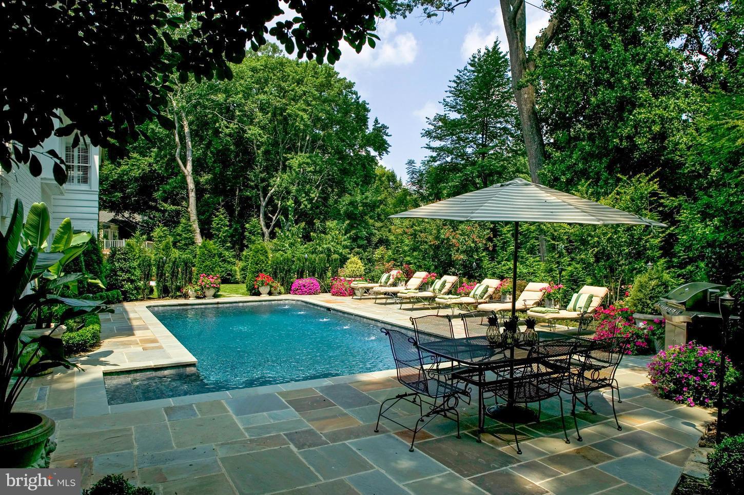 Unbelievable Value. Fabulous New Price.Thoughtfully renovated 6800 square ft. of living space. Six bedrooms, 6-full and 2-half baths,sited on nearly 1/2 acre lot. Chef's Kitchen. Elegant Living RM, separate dining RM. Comfortable family RM. Main level guest suite. Master Suite with his & her baths. Finished walk out lower level. Landscaped grounds. Heated Pool. Circular Driveway. 2 Car Garage.