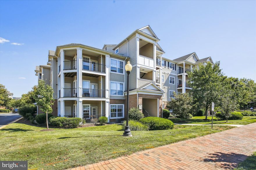 This is it!  Beautiful top floor unit with 2 Bedrooms and 1 Full Bathroom.  Beautiful and spacious with hardwood floors in the living/dining room, kitchen and hallways. Carpet in 2 super-sized bedrooms and one super sized bathroom with double sinks. Stainless steel refrigerator and dishwasher. Full size washer and dryer located in the unit. Of course, there's a lovely fireplace in the living room.  Oh, there's an extra storage closet in outer hallway.  The balcony is overlooking manicured grounds. Community has a large pool and a community complex with exercise and meeting rooms. Comes with 2 assigned parking spaces (150 and 151) and plenty of visitor parking.