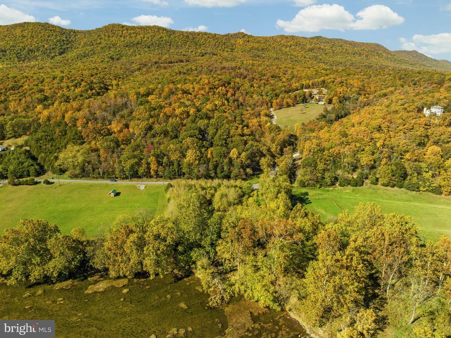 STUNNING 1.76 ACRE LOT ON THE SOUTH FORK OF THE SHENANDOAH RIVER JUST 1 HOUR AND 15 MINUTES FROM THE CAPITAL BELTWAY!  Rarely does a lot as perfect as this come on the market! Gentle slope to the river with stunning views of the mountains and across the river from Shenandoah State Park * Just one turn off 340 just past Down River Canoe on paved roads - super easy direct access * Shed with power already at the property and owner has a 4 bedroom perc certificate that would need to be renewed by new owner * HOA in place but no HOA fees * Feel free to walk lot with advance notice and see documents for additional plat and property information.