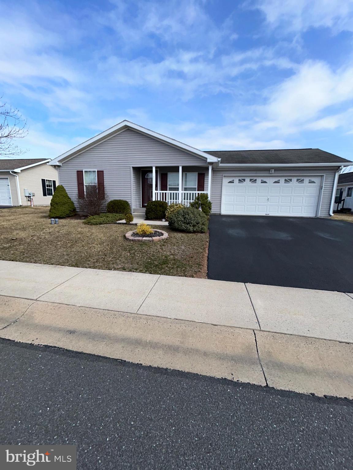 Active Adult 55+ Community,!!HOME WARRANTY!! INCLUDED !! Location, Location steps away from Club house , pool and activities., Our popular Holly IV Model featuring Double Master Suites, Each suite has its own large closets with Bathroom attached, Walk in shower with bench seat, other has tub shower combo, both have full linen closets. Front Porch leads into Living Room that is open to the 25' Kitchen, approx 9' island, with open pass thru to Living Room. Kitchen has an exit to Deck featuring private rear setting, also entrance to garage from kitchen. Kitchen also has Dishwasher, Garbage disposal built in Microwave, Pantry, stainless steel sink and overhead lighting. Laundry room with window and laundry tub. 2 entrances to Family Room from kitchen with honey comp window treatments, Stone gas fireplace with mantle, raised hearth with switch for blower and spot lights. The community includes a Club House with game rooms, gathering room, gym, Kitchen and exterior Heated Pool. Also included is grass cutting, snow removal and trash. Take a tour to care free living, easy to show.