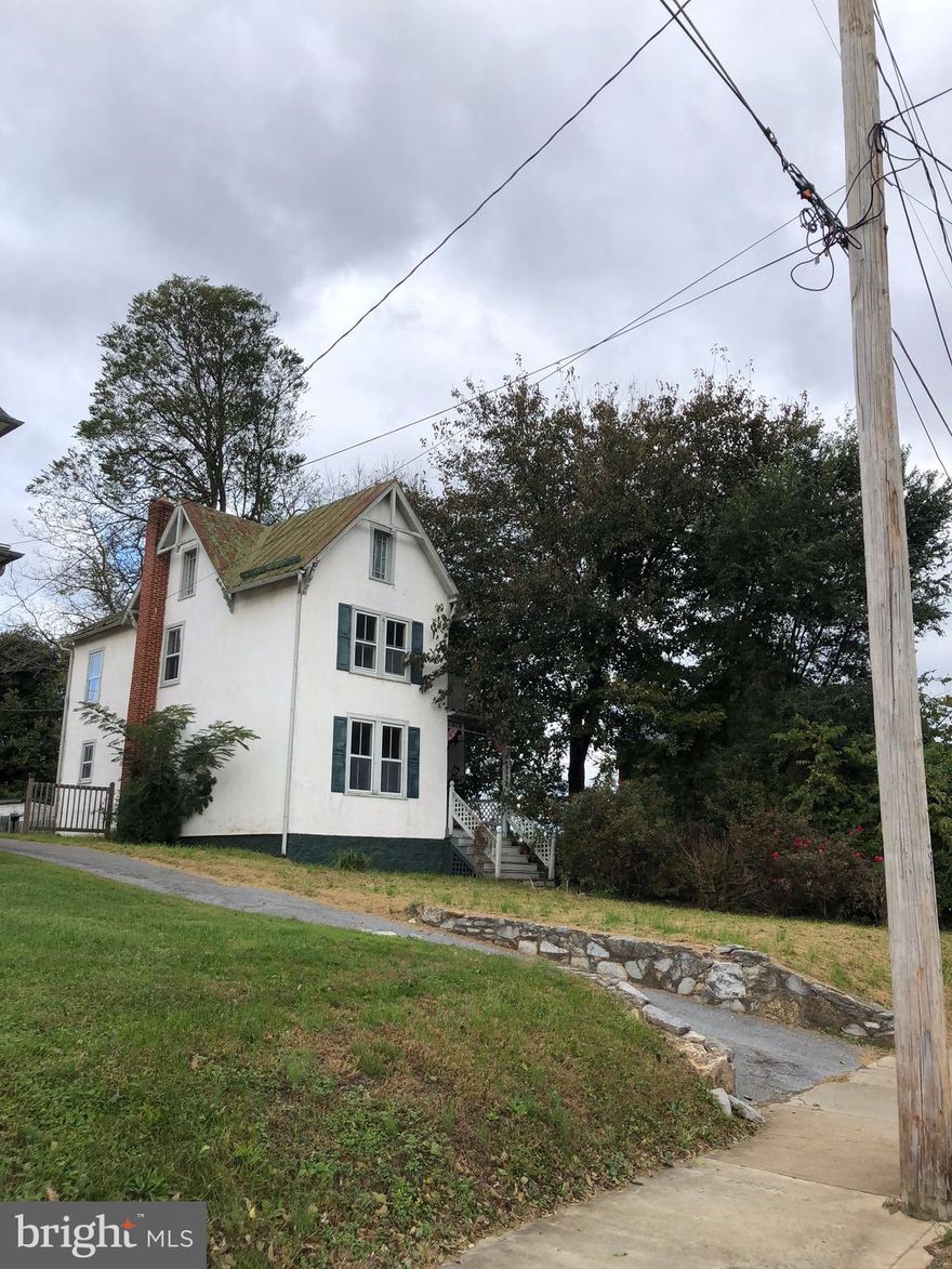 Currently in multiple offers with deadline of 3/13/19 at 11:00 AM EST. Awesome investment opportunity. Partially renovated with newer master bath. Gorgeous wood floors and archway. FHA 203K loan or cash to bring this Queen back to former glory.  Heat pump added 2008.  Walking distance to downtown, Amer. Public University and more. Convenient for commuters as well.Seller will not complete any repairs to the subject property, either lender or buyer requested. The property is sold in AS IS condition.