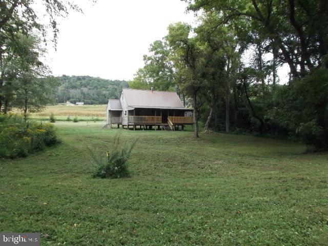 Fully renovated camp on 1.12 acres, corner lot with mountain and river views, river frontage and boat launch. Private well and septic. New 12x20 shed. New metal roof, vinyl siding and windows. Full Kitchen, Full Bath and Master Bedroom. Loft sleeps(4-6). Large porch. Furnishings and appliances stay. 100 amp service. HOA fee of $96.00 yr for road maintenance. Buyer and buyer agent to verify flood zone. Excellent fishing, boating and kayaking. Being sold As Is.