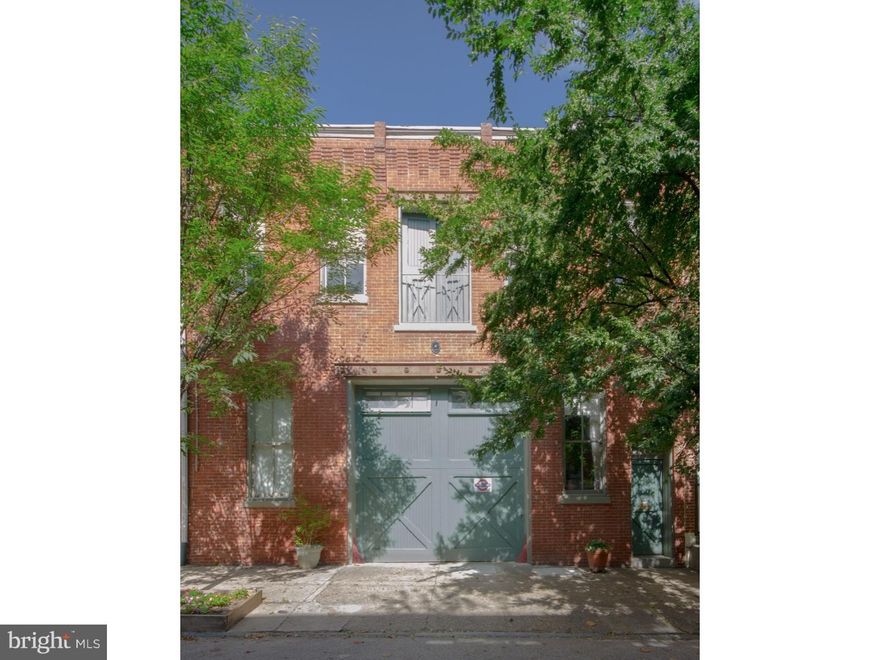 Extraordinary nearly 8,000 square foot carriage house, originally a 19th century livery stable. This unique property is zoned as a two-unit building with the spacious owner's unit of over 6,000 square feet. Natural light throughout. The owner's unit includes a first floor 3 car garage plus workshop plus photography studio. The studio and workshop have 14.5' ceilings. The main level of the owner's unit features 3 bedrooms, including master suite, 2.5 baths, open floor plan living room (25'x32'), central greenhouse (14' square), family room, meditation loft, 4 skylights and stairs to back garden. The living room with oak tongue and groove floors, consistent Northern light, tile lined Rumford fireplace, 13+ foot ceiling and door to balcony with stair to mature landscaped garden and pond with Goldfish. Additionally there is a bright octagonal family room with venting skylights, wood stove, lofted play area/meditation room. A mezzanine level of the owner's unit includes a separate guest suite with kitchen and full bath. First floor renter's unit with 1 bedroom plus den, full bath, spacious open living room and kitchen, custom double stable doors to mature landscaped garden with fish pond.