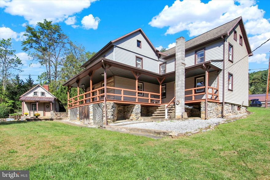 Discover a one-of-a-kind trout fisherman’s paradise in Adams County, Pennsylvania … just miles from Michaux State Forest, the Appalachian Trail, and historic Gettysburg! This charming 1880s two-story log home offers 1,770 square feet of character and comfort with 4 bedrooms and 1.5  bathrooms. Relax on the inviting covered front porch or the side wrap-around porch overlooking the tranquil setting.  Step inside to experience the original log construction showcased in the 20x16 great room/log room, featuring lath and log walls, exposed beam ceilings, a propane wood stove, and wide-plank wood floors. The remodeled country kitchen blends rustic charm with modern updates, and wood floors are hidden beneath the carpeting throughout much of the home. The property includes replacement tilt-in windows, oil hot-water baseboard heat, and generous attic and basement storage. Outside, a collection of outbuildings offers endless possibilities … workshop, garden shed, chicken coop, wood shed, or art studio. The highlight is the fabulous 1.5-story summer kitchen, ideal as a guesthouse, playroom, or creative retreat. The expansive lawn leads to a meandering path and a once-active trout stream, creating a peaceful haven for outdoor enthusiasts.  Whether you’re looking for a full-time residence, a weekend getaway, or an Airbnb investment, this property invites you to relax, explore, and enjoy the serenity of nature. Come see all the possibilities this historic log home has to offer!