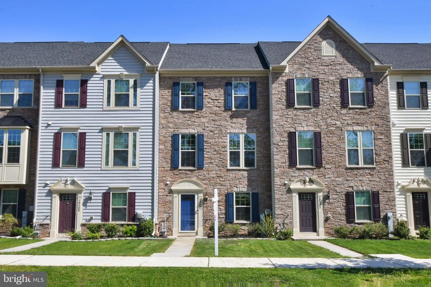 Absolutely Stunning Four-Level Townhouse offering plenty of living space and a 2 car garage. Main level family room/ office w/half bath, LR w/hardwoods, beautiful gourmet kitchen w/granite counter tops, backsplash,  42 " cabinets, breakfast bar, pantry and large dining area w access to deck. Living room also has the plumbing ran for a half bath. Spacious Master bedroom  with a beautiful tiled master bathroom w shower, bathtub, and double vanity sinks. 2 additional bedrooms with full bath in the hall way and wash/dryer. 4th bedroom or loft on 4th level with a full bath and access to balcony. PRICED TO SELL!!!