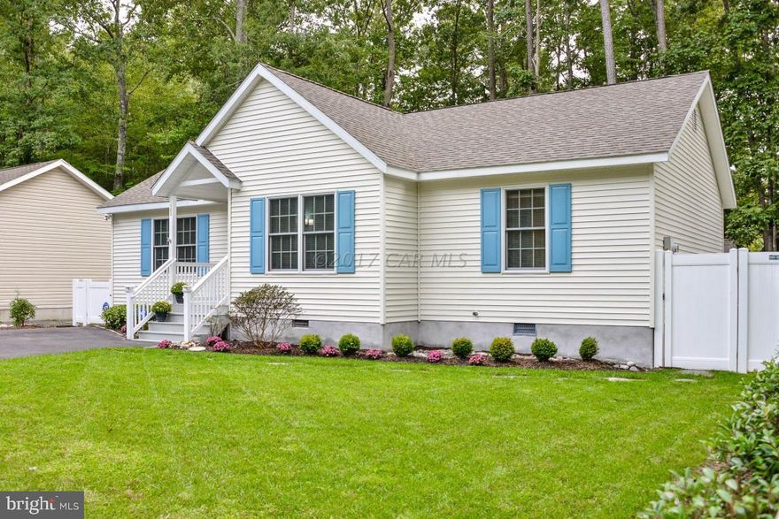 This beautifully maintained, Lynn Crockett built, split floor plan home is absolutely move in ready. Nice sunroom, screened porch and separate laundry/utility room are excellent features. Paved driveway, vinyl fencing, large storage shed, fresh foundation parging, cleared front yard and nice landscaping are a few of the exterior features that make this home low maintenance and super friendly. Allure Plus waterproof luxury vinyl plank flooring installed throughout.  Cathedral ceiling and fresh paint make this home light and bright. Updated bathrooms, paddle fans, outlets and switches are just the icing on the cake.  This is a perfect year round or vacation home.