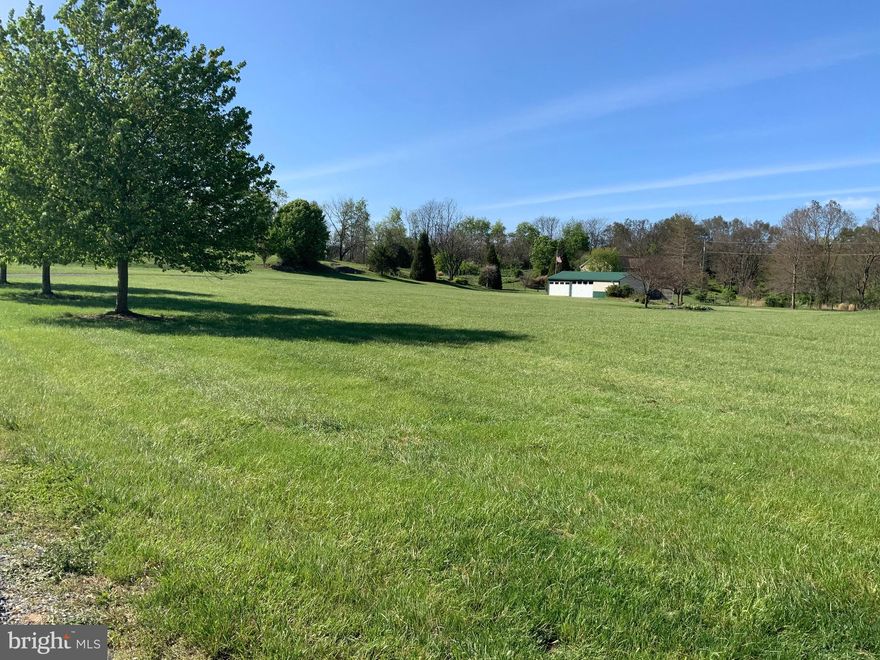 Beautiful 5 acre building lot for your dream house within minutes of Berkeley/Jefferson County line- only 3.5 miles from Shepherdstown WV, 7 miles from Martinsburg, and 14 miles from Charles Town. This lot is very lightly restricted (no mobile homes, no junk yards, no unlicensed vehicles), no HOA, cleared, completely fenced with gate, has existing well (2019), 300 gallon underground sewer storage tank for garage and camper use,  up to six car garage with electric and water, utility sink, and rough in for commode), gravel driveway, conveniently located near schools, and shopping/dining options. Country setting yet close to all modern amenities, public transportation, Shepherd University and Cress Creek.