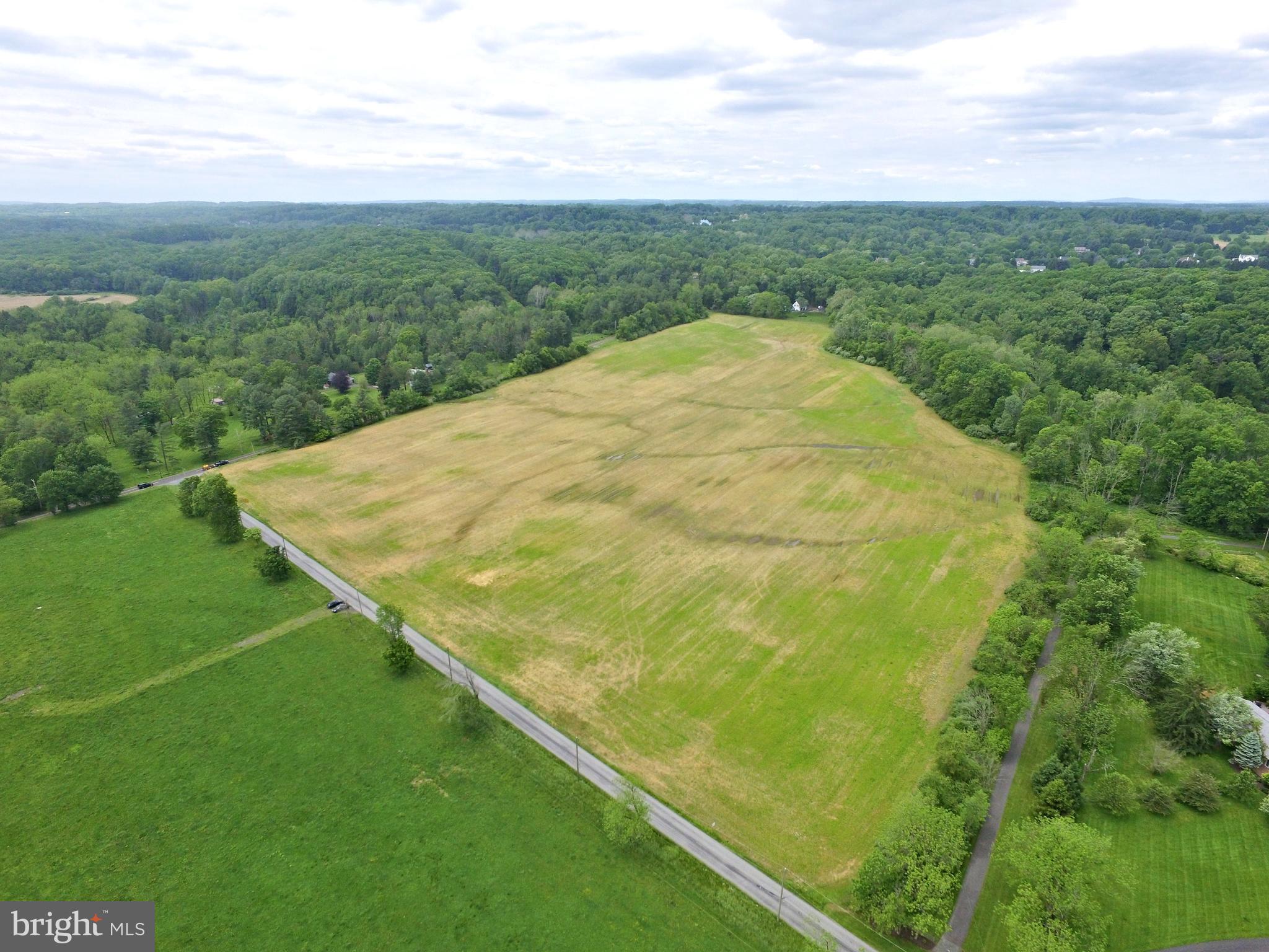 Situated at one of Bucks County's most storied and desirable locations, this magnificent 47 acre parcel represents what may be the last and final opportunity to build your dream home on Meetinghouse Rd. in the heart of Solebury. Land consists of approximately 35 acres of gorgeous cultivated farmland and 12 acres of lush woodlands, with meandering stream. Long distance views and scenic beauty abound. Conservation easement allows for construction of one single family house and accessory buildings/improvements. Set amidst neighboring properties that are mostly large parcels with luxury/estate homes, no subdivision is permitted. Located just minutes from New Hope Borough, Peddler's Village, Doylestown, New Jersey Bridges, and 90 minutes from Manhattan and 60 minutes from Philadelphia. Once in a lifetime opportunity awaits the discriminating buyer.