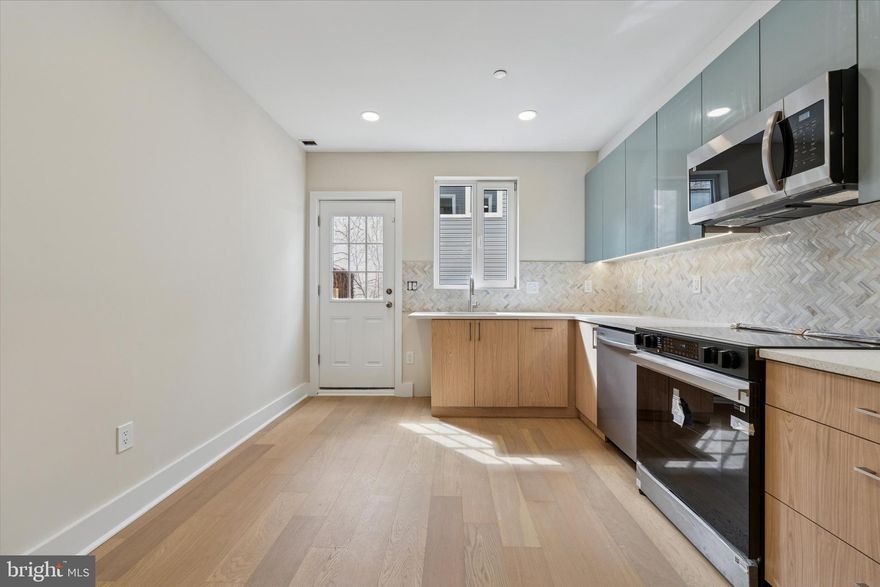 Welcome to 2440 E Harold Street, a stunning, brand-new construction home nestled in the heart of Fishtown overlooking Aramingo Square. This modern residence features 3 bedrooms, 2.5 bathrooms, and over 2,000 square feet of beautifully finished living space. Step inside to discover wide-plank hardwood floors, recessed lighting, and large living space with high ceilings. The chef-inspired kitchen showcases stainless steel appliances, quartz countertops, a custom tile backsplash, and elegant dual-toned cabinetry—perfectly balancing style and function. The second level offers two spacious bedrooms with generous closet space and a well-appointed full bathroom. The third floor is dedicated to the luxurious primary suite, complete with a spa-like bathroom featuring double vanity sinks, heated floors, a soaking tub, and contemporary finishes. Head up to the private rooftop deck and take in sweeping skyline views—an ideal setting for entertaining or relaxing. The basement offers extra storage space and includes a convenient powder room. This exceptional home is also equipped with a dual a/c system, a wet bar, and a 10-year tax abatement for added value. 2440 E Harold Street is complete with a security system that includes a motion sensor, glass break sensor, and door open sensors, along with a surveillance system with front and back cameras.  Located just steps from Fishtown’s best restaurants, bars, coffee shops, and parks, this home offers the perfect blend of modern comfort and urban convenience. Schedule your private showing today and experience the best of Fishtown living!