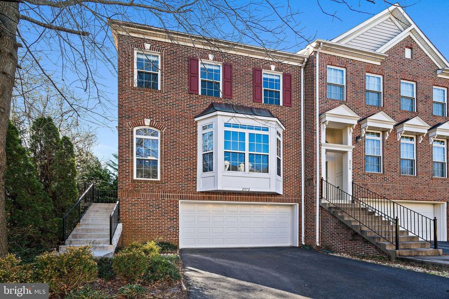 Welcome home! In the heart of Fairfax, this spacious townhome is lovely with tree-lined privacy and sunny end-unit appeal. Inside, 2,600+ square feet features hardwood floors, soaring windows, and refined trim lining high transitions and shelving for favorite reads and memories. While the inviting kitchen with wow-worthy range hood, Kitchen Aid appliances, and new countertops assist with weeknight meals and dining-room perfect celebrations, dual views of the sitting room, and airy drop-down living room inspire plans for gatherings warmed by the fireplace. Host summer BBQ’s on the new sophisticated composite deck, create a patio garden, or complete projects in the two car garage. Four spacious bedrooms and three and a half restful baths soothe for dreaming, while in the sprawling primary suite, enjoy sitting nook and quiet space for work. While touring, visit the newly floored lower level with bedroom and full bath. Walk out to the spacious fenced yard and bricked patio.  Over $65,000 in recent improvements! Master bathroom, Hall bath floor & countertop, New Paint, New Hot Water Heater, New Furnace, New Kitchen Countertops/Cabinets/Drawers, New Fixtures, New Carpet (2021/2022), KitchenAid appliances (2020), New Roof (2018), AC (2019), Patio Door and Window (2021), Custom blinds (2021), Composite deck (2019), LG washer and Dryer (2021) and lower level engineered wood flooring (2019), New Garage Door & Opener (2019). Enviably located near the Mosaic shopping district, you’ll also adore close proximity to 1-66 & 495. Just a mile to the Vienna Metro, and Dunn-Loring Metro.