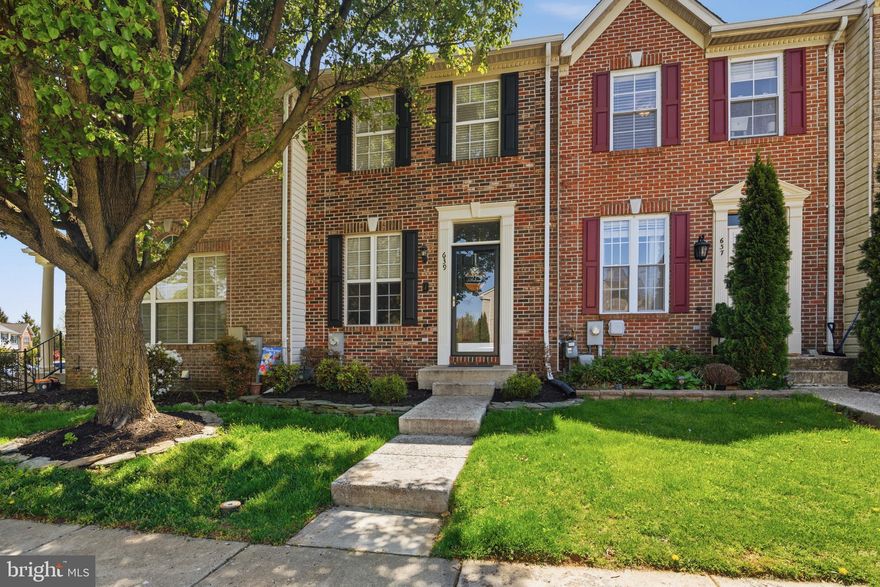 Well maintained 3 bedroom 1.5 bath brick front townhome tucked away in the sought after Hickory Overlook community, offering a quiet setting while still being conveniently located near shopping, dining, and commuter routes. The home features a functional layout with plenty of natural light. The main level includes a comfortable living area and an updated kitchen with island, stainless steel appliances, and space for dining, with access to a rear deck and covered patio. Upstairs offers two bedrooms and a full bath, while the finished lower level provides additional living space with a rec room, half bath, laundry area, and a third bedroom with walkout access.