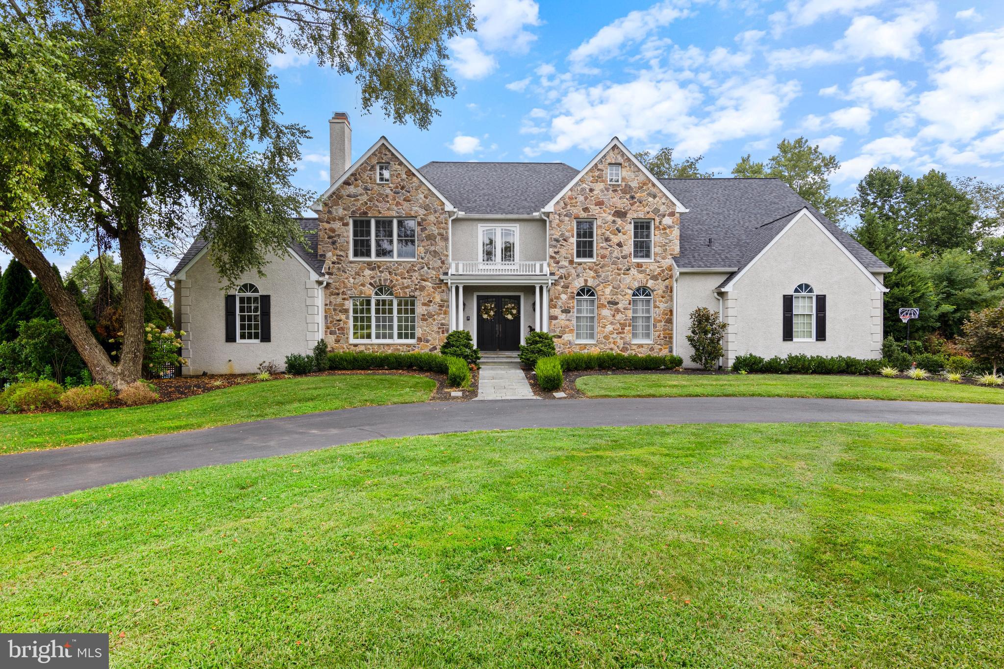 Welcome home! Be prepared to be captivated by this stunning, estate style home, nestled on 2+ private acres in the heart of Chadds Ford and in the award winning Unionville-Chadds Ford School District. The property is located within a cul-de-sac neighborhood which features just 7 other homes and is adjacent to protected lands. This gorgeous, 4 bedroom, 5.5 bathroom home with a finished walkout lower level is the epitome of luxury and comfort. As you approach you will be immediately struck by the curb appeal of the property with a circular driveway and a natural stone façade which sets the stage for the elegance that awaits inside. Step through the entrance into a spacious foyer with sweeping views of the second floor and an elegantly coffered ceiling, flanked by a formal living room with a cozy gas fireplace, perfect for hosting friends and family. Through the living room you will find the large office complete with sweeping window views and rod iron chandelier. Heading back through the living room you will find the dining room featuring beautiful millwork, wainscoting, and a tray ceiling, this space is ideal for hosting elegant dinners and holiday gatherings. The open floor plan seamlessly connects the gourmet kitchen, breakfast nook, family room, complete with wood burning fireplace, creating flow and space for both everyday living and entertaining. The kitchen is a chef's delight, featuring spacious custom cabinets, stone countertops and matching backsplash, peninsula and updated appliances. Off the breakfast room you'll find the rear deck which is an idyllic spot for barbecues and enjoying the serenity of the backyard. Talking about the backyard, meandering down from your deck you will find the dedicated pool space intelligently placed to the left which allows for unobstructed views from the dining room, kitchen, and family room of the beautifully flat and open expanse of green grass. This is the ideal yard to toss a ball, put up a lacrosse net, or install the jungle gym which will make your yard the envy of all children. The in-ground pool has been re-plastered and features room a sundeck for lounging and an elegant pergola for entertaining. Take a moment to imagine hot summer days spent moving between the pool, deck and a game of baggo in the yard, luxurious perfection. Heading back inside, the home boasts soaring ceilings and exquisite hardwood flooring throughout, enhanced by detailed moldings and wainscoting that add a touch of charm and sophistication in all the right places. A powder room, bonus full bathroom, first floor laundry and mudroom with built-ins, and a 3 car attached garage complete this floor. The second level features 4 bedrooms and 3 full bathrooms. The primary suite is fit for royalty including a huge bedroom with tray ceiling, sitting room, large walk-in closet, and a freshly reimagined primary bathroom, with dual sink vanity with a stone countertop, a spacious tiled shower, soaking tub and a separate water closet. Finishing out the second floor, there are 2 well sized bedrooms connected by a jack and jill bathroom and an additional bedroom suite. The finished walk-out basement feels like anything other than a basement. This bright and inviting space features a kitchen for entertaining, full bathroom, natural stone accent wall and space galore. Truly a perfect additional living area for everyday use or entertaining. Conveniently located near all that you need make this one you will not want to miss, schedule your tour now!