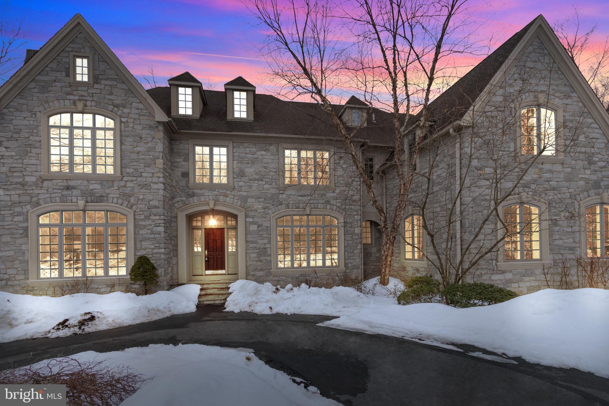 Custom Elegance in Gwynedd Valley! Set back along a private drive, this exceptional, stone front estate home will WOW you from the moment you enter the property. Surrounded by scenic landscape and mature trees, this stunning residence welcomes you with a grand Foyer that spans front to back with gorgeous details and open spaces flooded by natural light. Hardwood Floors flow from the formal Living Room with slate Fireplace to a charming Study with Tile Fireplace and views of the lush surroundings. A formal Dining Room invites festive dinner parties and features custom millwork and an adjoining Butler's Pantry that beautifully leads to a large Kitchen with 6-burner gas cooktop, center island and sun-filled Breakfast Room with vaulted ceiling and French door to a mahogany deck. The stunning Great Room with hardwood floors, custom built-ins, vaulted ceiling and wall of windows creates a dynamic space for relaxation and entertaining. Upstairs, hardwood floors continue throughout the 2nd and 3rd floors of living space complete with a luxurious Master Suite with sumptuous Bath and Sitting Area, 5 additional Bedrooms, 4 full Baths and an awesome private space for work, writing or studying. This incredible home continues with an expansive 50's themed Lower Level with game area, soda-shop style bar, Full Bath and French Doors that walk-out to your very own backyard oasis complete with gorgeous Pool and Hot Tub, Patio and outdoor Kitchen!! With a 3-Car Garage, 3-Zones of heating & cooling and a prime location close to parks, shopping and public transportation, 208 Cathcart Road is the estate home you have been searching for schedule your private tour today!