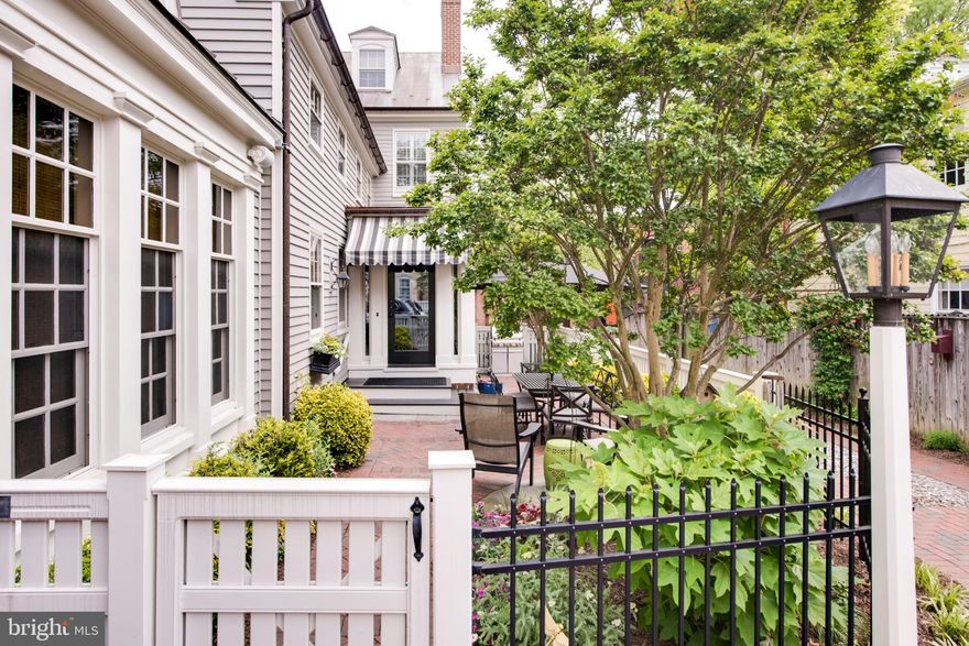 Historic Annapolis at its finest! This elegant, impeccably updated Federal Style residence was built circa 1840 and restored by John Pilli, a recognized Annapolis builder. This luxury residence is complimented by 3 gas fireplaces, beautiful walnut & heart of pine wood floors, a stunning staircase, wine cellar, and modern updates throughout. Fabulous chefs kitchen with top of the line appliances, farmhouse sink, and gas range. The main level includes a comfortable Living room, Sun Room, & Professional office / library with cathedral ceilings, large custom cabinets, desks, and display shelves. This spacious 4 BR / 4.5 BA home includes a gorgeous master suite w/ large bath, double vanities with granite counters, separate soaking tub, walk-in shower, and California closet. Views of the Maryland State House Dome from 3rd BR. Fully finished Lower Level with additional guest quarters & 2nd Laundry area. Extensive recent upgrades includes new $100,000 copper roof and gutters, and much more! Coveted off-street parking for 2 cars. Beautiful landscaping, patio and garden! Multiple zone & energy efficient heating & AC. Perfect in town residence with over 4500 sq feet of finished living space . Steps from City Dock, St. Johns College and the U.S. Naval Academy.