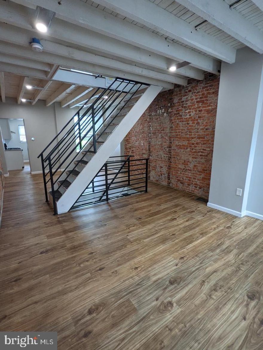 Beautifully renovated two bedroom home! This home has been renovated from top to bottom. The first floor you'll find an open floor plan and an open staircase with new flooring and fresh paint. The kitchen is in the rear with new stainless steel appliances and plenty of cabinet space! Off of the kitchen you'll find a large back patio. Upstairs you'll find a large primary bedroom, a lofted bedroom and a spacious bathroom with stall shower! The basement offers plenty of storage space along with your washer and dryer. Best yet - this home features central air!