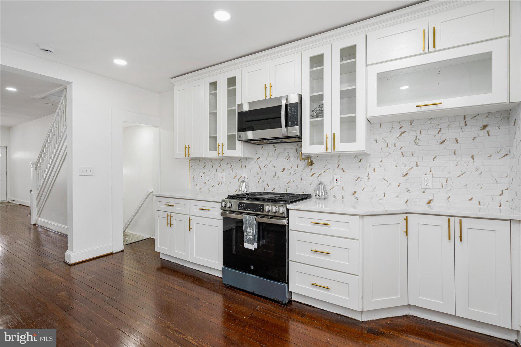 Beautifully renovated 4BR/3.5BA brick Townhome located in the quiet neighborhood of Clifton Park. Make your way to the newly updated covered front porch and open the door into your forever home. Step into a crisp clean main floor featuring a gleaming dark hardwood floor throughout the open concept floor plan. The open floor plan allows you the ability to engage with family and friends from the spacious living room, cozy dining room or stunning kitchen. The kitchen features mixed metals boasting gold accents against the stainless steel appliances, plenty of cabinets to the ceiling finished with crown moldings, sleek quartz countertops, a backsplash which complements the mixed metal, and a corner sink under a raised breakfast bar with seating and glamorous pendant lighting. Completing the main floor is a half bath, and tucked behind the kitchen a mud room. The gleaming hardwood flooring continues through the second floor bedrooms. The newly remodeled and beautifully tiled shared bath is just steps from the two secondary bedrooms. A large primary bedroom beams with tons of natural light and offers a newly remodeled full bath with a beautifully tiled walk-in shower with a spa shower feature. The lower level is finished offering additional living space including the fourth bedroom, a full bath with walk-in shower, laundry, storage, a spacious family room, and a walk-out to the fenced yard. From the mud room, step out onto a newly constructed stairway that leads to the patio with tons of possibilities. This home is move-in ready, ideal for any new homeowner, and is located in close proximity to shopping, restaurants, and commuter routes.
*Seller prefers to use Front Porch Title*