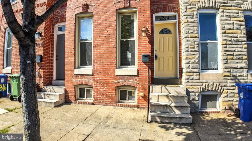 Charming brick-front home featuring tile floors throughout the main level and a striking exposed brick accent wall. The first floor offers a convenient half bath and a kitchen with rich cherry cabinets. Upstairs, you’ll find two spacious bedrooms and a full bath with beautiful hardwood floors. The basement provides additional storage space, adding to the home’s practicality and appeal.