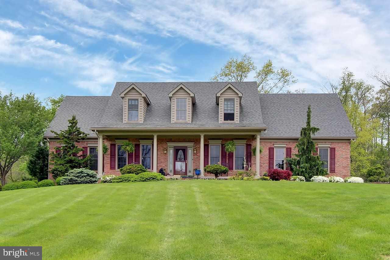 Paradise. That's what you call home at this amazing country estate. Perched on 92 acres of rolling Southern York County land, this home has farmland, woodlands, a bubbling trout stream, & a custom 4 bed/3 bath home overlooking all of it. The main house has an Amish-built oak kitchen, first floor master, cathedral great room, & tons more. Stunning professional landscaping. Limitless possibilities for a 4800 sq ft heated pole building w/lift.