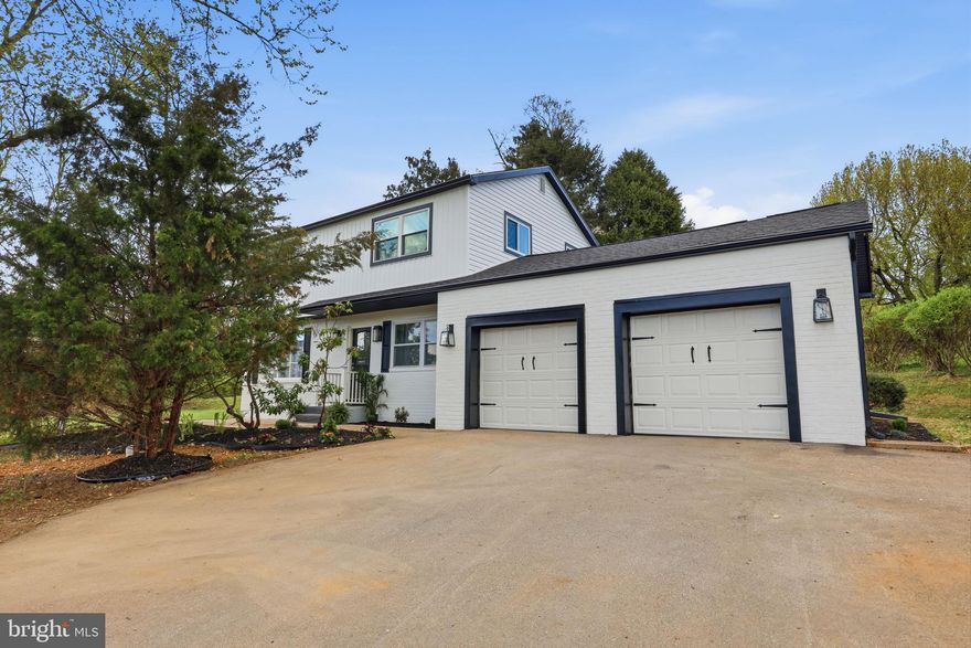 Welcome to this beautifully remodeled 4-bedroom, 2-bath home offering a bright, neutral palette and an inviting layout throughout. Step into a welcoming foyer with a spacious living room to the left and formal dining room to the right, flowing into an open-concept kitchen featuring granite countertops, granite backsplash, two-tone cabinetry, center island with bar seating, recessed lighting, and abundant natural light. The main level also includes a beautifully updated full guest bath with floor-to-ceiling tile and a stand-up shower. Tucked privately beyond the kitchen, the separate family room offers vaulted ceilings, a wood-burning fireplace, and sliding door access to a brand-new wood deck and backyard—creating the perfect space for relaxing or entertaining. Upstairs features four spacious bedrooms, including a primary bedroom, and a fully remodeled full bath with floor-to-ceiling tile and tub/shower combination. The finished basement offers additional living space with new carpeting, neutral finishes, and a spacious laundry area. House features brand new roof, siding and 2 zone AC/HVAC on first floor.  Additional highlights include a two-car garage, spotlighting throughout the first floor, and extensive updates throughout the entire home. House has been connected to public sewer by sellers. Home is located in award winning Springfield School District, close to shopping malls, schools, PA Turnpike, Road 309 and many other attractions.  Truly move-in ready with every detail thoughtfully remodeled.