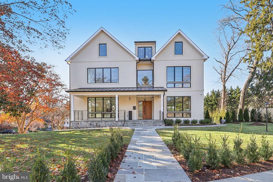 New Price!
Welcome to 4920 Loughboro Road NW, a custom showpiece located across a broad corner lot, complemented by handsome Jeld-Wen casement windows, is but a taste of the quality and craftsmanship you’ll discover inside. Across the flagstone walk, welcoming porch and into the soaring foyer, you may well catch your breath as you savor the Brazilian white oak floors, stunning designer light fixtures, and sophisticated finishes. But be sure to pace yourself – you’ve got nearly 10,000 square feet of designed living space across four meticulously finished levels, including 7 bedrooms and 8.5 baths. A thoughtful and practical addition, the private elevator will ease your journey. Along the primary floor, a formal living room and separate family room both enjoy front-facing views across this charming Kent/Palisades/Spring Valley neighborhood, arguably the toniest part of town. To the rear, one of two primary ensuite bedrooms features an ample walk-in closet and peaceful private balcony. The paired double kitchens, however, offer the height of design, function, and quality. The main kitchen, wrapped in delicious Eurostyle Leicht soft-close cabinetry, to include Topos Bergamo elm veneer accents, features every inspiring ingredient to execute culinary magic. Superb Miele appliances – from oven/range to dishwasher to refrigerator to built-in coffee machine, and so much more – ensure chef-quality magnificence. Combined with the secondary all-season room/outdoor kitchen, this arrangement allows for entertaining on grand scale. The sizable, low-maintenance Trex deck just beyond guarantees your guests will have plenty of room to spread out. Above, all four second-floor bedrooms feature walk-in closets and ensuite baths. Here, however, the second primary bedroom is a vast oasis, with dedicated sitting area and dressing room. Its spa bath in porcelain and marble is an inspiring invitation to liquidate the day’s stresses with a soothing soak or steamy escape in the breathtaking double-headed walk-in shower featuring LED lighting, Bluetooth music options, and multiple spray patterns. Higher still, the flexible attic level houses another ensuite bedroom, storage space, more than enough room to add yet another bedroom, and hundreds more unclaimed square feet of living space. The lowest level, however, is hiding quite a few of 4920 Loughboro’s fabulous features. The indulgent Alpine 3-person sauna is a high-tech haven, offering both infrared heaters and chromotherapy. A WhisperKOOL ductless split climate-control system keeps up to 806 bottles at perfect temperature in the sophisticated wine cellar. Along with a pre-wired home theatre and a room for a home gym, the lower floor includes another ensuite bedroom. Exit directly to the yard via the mud room, to include full secondary laundry facilities, or through the attached two-car garage with EV charger. You’ll appreciate a commanding sense of security and control with multiple-camera surveillance, alarm system, Ubiquiti networking, and next-generation URC smart controls. Truly, this property resides in a class of its own conveniently located near top schools, dining,  Regan National, and downtown  DC.