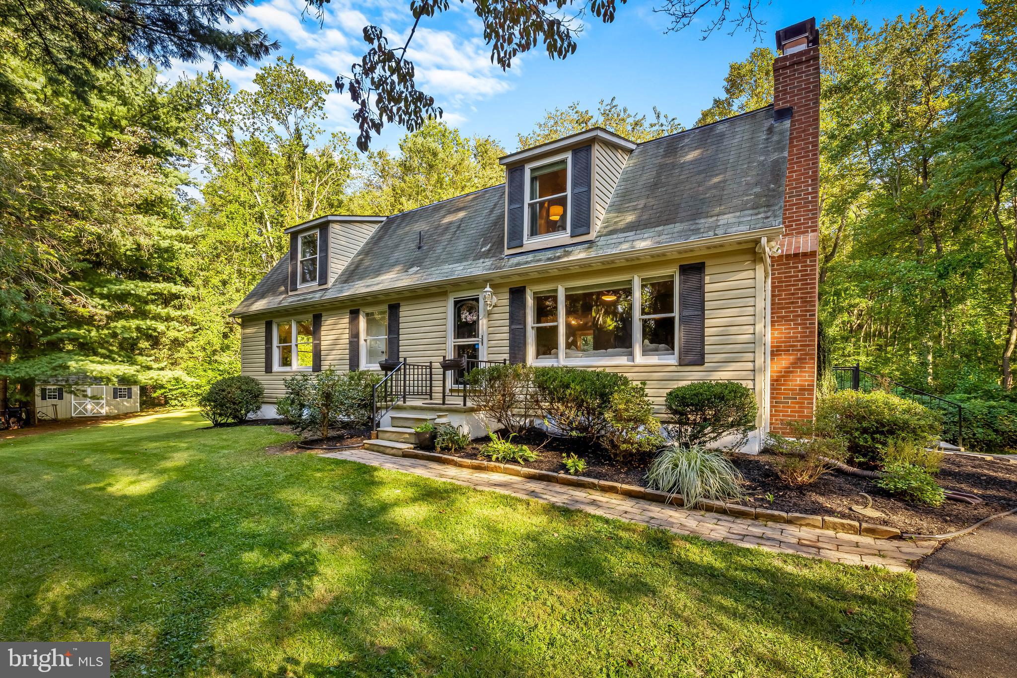 Nestled on a private and serene 3-acre lot, this beautifully maintained Cape Cod offers privacy and convenience. Enjoy peaceful living just steps from the NCR Trail, a yoga studio, spa/salon, and minutes to I-83, Mount Carmel, and Hunt Valley. Imagine your own garden, chicken coop, and farmette style living, all while enjoying the sights, sounds and serenity of nature as you relax on the patio.Â
This 4-bedroom, 4-bath home is designed for flexibility and comfort, featuring two primary suites—one on the main level and one upstairs. Three bedrooms are oversized with ensuite baths, while the fourth makes an ideal nursery, home office, or fitness room adjacent to a hall bath.
The main level welcomes you with a warm and inviting layout. In addition to one of the primary en-suites and fourth bedroom, the main floor features an updated kitchen with granite counters, stainless steel appliances, and dining area, along with a cozy living room and wood-burning fireplace.  Upstairs, choose between two spacious ensuites, one with a large walk-in shower and dual sinks, the other with a shower/tub combo.
The finished lower level (renovated in 2018) offers additional living space with vinyl plank flooring, built-ins, recessed lighting, and a pellet stove in the family room. A separate area provides the laundry area and ample room for plenty of storage, and a home gym, or whatever your home owner wants may be.
Recent updates include the roof (2015), water heater (2016), washer/dryer (2016), shed (2016), a complete well system with conditioner, neutralizer, filter, reverse osmosis, and UV light (2017), new carpets on upper level (2020), freshly painted rooms, landscape lighting around the house and up the driveway (2021).  Additional highlights are the parking pad for 5–6 vehicles (plenty of room to add a garage if you prefer), and a paved driveway, which includes the right of way for the separately owned and undeveloped setback-rear parcel. This home combines modern updates, flexible living spaces, and a tranquil setting—perfect for today’s lifestyle. Don't let this beautiful retreat, located in the Hereford school zone pass you by