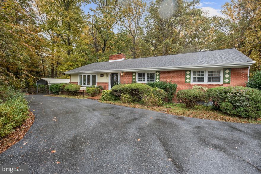 Lovely brick rancher privately situated on nearly 5 acres! Quietly set beyond mature trees a vast circular driveway welcomes you to this sprawling property with opportunity to create your dream home! The warmly functional floor plan provides perfect flow for entertaining and everyday living. Spacious formal living room hosts a bay window, and brick surround wood burning fireplace. The expansive eat-in kitchen provides table space for a breakfast nook, granite counters, and a brick surround wood burning fireplace. Enjoy the convenience of 4 sprawling bedrooms and 2 full baths on the main level! Travel downstairs to find a family room with an additional wood burning fireplace, a game room with billiards table, a wet bar, full bath, and expansive storage area! Commuter routes including I-495, I-95, MD-295 and the nearby Largo Town Center and New Carrollton Metro Stations offer convenient access to Washington DC, Silver Spring, Annapolis, and more. Close proximity to Waugh Chapel Towne Centre, FedEx Field and Baysox Park for shopping, dining and entertainment.