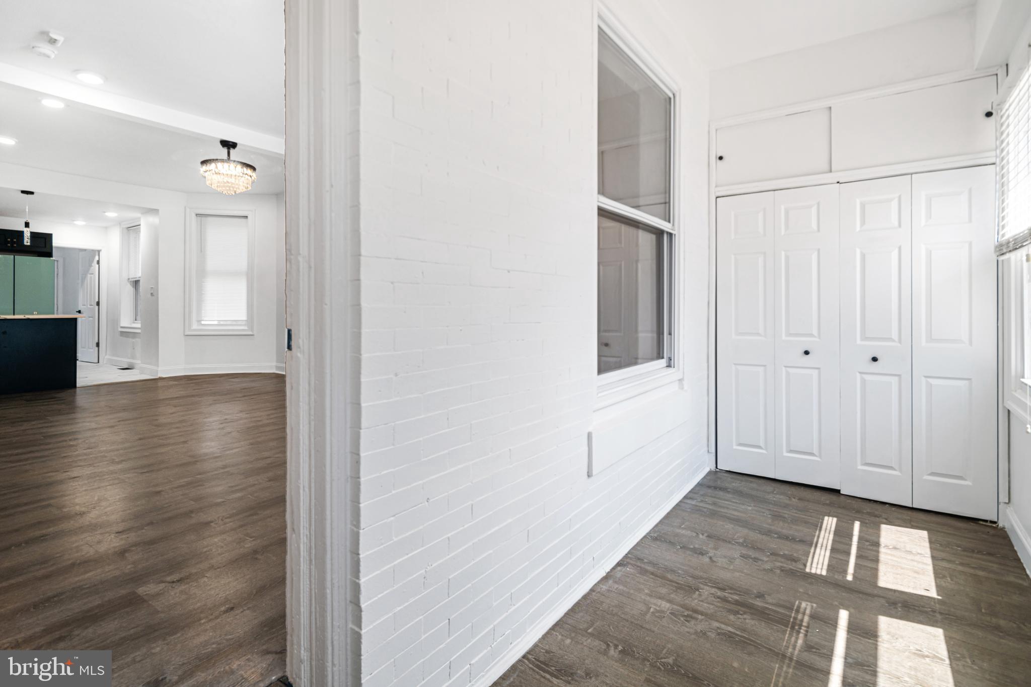 Welcome to 1345 S Wilton Street – a fully renovated 3BD/2BA home on a quiet block in the Kingsessing section of South West Philadelphia. This move-in-ready property features an open floor plan, luxury vinyl plank flooring, recessed lighting, and abundant natural light throughout and elegant chandelier with ceiling fan capabilities. The chef-inspired kitchen includes matte black cabinetry, quartz counters, herringbone backsplash, a statement refrigerator, and gold-accented fixtures followed by a laundry room complete with washer and dryer.
Upstairs you’ll find three spacious bedrooms and a spa-style full bath with floor-to-ceiling marble-look tile, black hardware, and a modern vanity with bluetooth speakers. The fully finished basement offers a large bonus space and additional full bathroom—ideal for a media room, guest suite, or home office. Private rear entrance and updated systems throughout. Convenient to University City, SEPTA lines, Clark Park, and Cobbs Creek Park. Schedule your showing today!