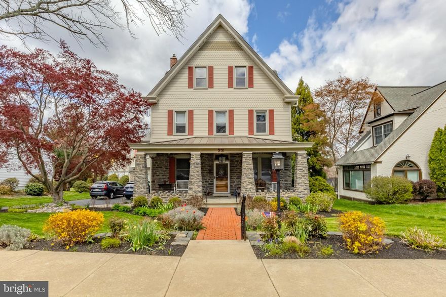 Welcome to this stunning home at 32 Llandillo Road in Havertown’s Llanerch neighborhood.  If you’ve ever driven down Llandillo, you've likely admired this incredible home, w/ its beautiful stone pillars, front porch, high peaked roof & manicured landscaping.  Walking up, you’ll notice great attention to detail including the brick paver walkway leading to the front stone pillared porch w/ standing seam metal roofing, multi styled vinyl siding, red shutters, a stone pavers from the driveway to the front porch & a wide driveway, great for side by side parking.  Entering the home, 9.5 ft ceilings & beautiful hardwood floors lead the way w/ tall windows allowing great natural light into all spaces.  The first floor begins w/ a living room w/ corner fireplace (wood), custom lighting & a 3 window bay.  To the right, you’ll find a large den w/ built in cabinetry (entertainment & storage) & custom lighting.  Next you’ll notice, a full glass French door, leading to the back gardens & patio, next to the stunning staircase with intricate wood railing that rises all 3 stories. To the left, you’ll walk through an open dining room w/ large bay window, before entering the kitchen.  Flooded w/ natural light from a well placed skylight, the kitchen presents beautiful blue & white cabinetry, custom tile backsplash, custom lighting, quartz countertops, stainless steel appliances (including double oven and commercial grade refrigerator), a center island with gas cook top & great storage w/ large pantry cabinets.  Additionally, a half bath sits off the back left of the kitchen & sliders, along the back wall, lead to the backyard & paver patio.  From the kitchen, a short set of stairs lead down to a great room that offers many possibilities & includes a full bath w/ stall shower, a very large storage closet, & a no step entrance from the driveway.  Whether you're looking for a great living space or an in-law suite, this may be just right.  
Heading up to the second floor, a open hallway gives easy flow & access to many rooms starting w/ 2 large bedrooms.  The first to the left includes an original built-in closet, w/ mirror and drawers. The next bedroom offers great space along with a very large walk-in closet w/ custom organizers.  Next you’ll find an impressive laundry room w/ utility sink & plenty of storage. A renovated hall bath comes next w/ custom tile work, vanity w/ antique Carerra countertop & tub w/ shower.  Further, you’ll enter the primary suite that starts w/ a sitting/dressing room w/ multiple large closets & could easily function as a home office.  4 steps down, you’ll enter the main bedroom w/ great windows & high ceiling.  This connects to the primary ensuite bathroom & extensive walk-through closet area that includes a soaking tub, stall shower w/ seamless glass, skylight, 2 vanities & multiple closets for all your storage needs.  Ascending to the 3rd floor up the impressive staircase, a built-in bookshelf sits at the first landing w/ high windows above making for a very beautiful & naturally bright space.  The 3rd floor includes 2 large bedrooms, as well as, a newly finished full bath w/ 2 vanities & a stall shower.  You’ll also find a conveniently located large utility/storage room off the back of the bathroom.  Back downstairs, the large unfinished basement can be accessed by a spiral staircase off the kitchen or from the right exterior of the home. Walls have been re-parged and the space offers great ceiling height and plenty of space for all your storage needs.  Out back, you’ll find a paver patio w/ accent lighting, a small water feature(pond), & a fenced rear yard with professionally maintained landscaping showcasing an array of plantings & trees. Other great features include replacement windows throughout (except at staircase), a lawn irrigation system, 3 zone HVAC & custom window treatments. Blocks from Chatham Park El, minutes from Brookline Blvd, the New Haverford Twp Library, Pennsy Trail & more!