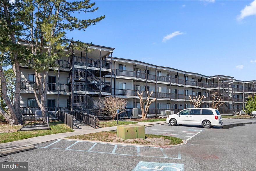 A direct bayfront location Simply one of the most picturesque bay views in town--osprey, heron, egrets--you'll find them all here! A spacious enclosed porch is a great feature, providing a comfortable space where you can relax and take in the serene surroundings and added bonus of stunning sunsets over the marsh grasses and bay. The condo has been well-maintained and used gently as a weekend getaway and in good condition. This 2-bedroom 2-bath condo is a non-rental. The unit has wood laminate flooring in the hall, kitchen, and dining area. The living room has an electric fireplace installed in 2018 with a heat blower fan and new mantel.  There is a bonus closets space to put all your beach items away. Open floorplan provides plenty of space to entertain. This quiet location has a large outdoor pool, close to the beach, shopping, and dining.  Put this one on your list to see.