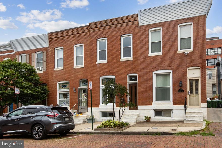 Welcome to 137 Rochester Pl - a gorgeous 3 bedroom, 1.5 bath home in sought after location right next to Patterson Park!  Historic charm meets modern design with exposed brick, stained glass, and entry way.  Gorgeous hardwood floors in the spacious living room lead to the updated kitchen with granite countertops and stainless steel appliances.  Continue upstairs to find three generous bedrooms and updated full bath.  The finished basement provides more room to work, play, or relax plus room for storage.  Newer roof, new HVAC system, new hot water heater, new dishwasher, new microwave, and ample parking! Don't miss this fantastic opportunity!  Priced to sell fast and won't last long!  Schedule your tour today!