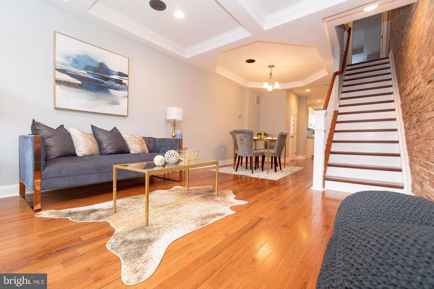 Welcome to 1423! City living at its finest! This townhome has been meticulously renovated from top to bottom. The first floor boasts tons of natural light, open concept throughout, beautiful hardwood floors, and a brick feature wall. The main level is complete with a convenient half bath. Basement has a generously sized bedroom and full bathroom. This home has a beautiful owner's suite with beautiful en suite bathroom and has access to a roof top deck for outdoor living. Picture the entertaining that can be done on this deck. This is conveniently located to JHU, restaurants, parks and more! V2V and LNYW eligible... Come see it today!