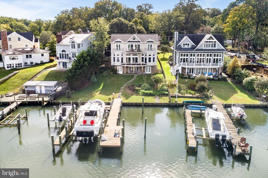 This truly extraordinary Spa Creek waterfront features outstanding dockage, exceptional smart design and is a superiorly built home.  Soak in the sensational views from virtually every spacious, sun filled  room. An true entertainer's home, the open floor plan is perfect for wowing guests both inside and out. Boater's dream dock, new in 2016, features 40,000 lb and 8000 lb lifts, 4 slips and even wifi.Dramatic views from ipe decks with custom stainless hardware. 3 gas fireplaces, 12 ft. ceilings, cherry hardwood floors, chef's kitchen, a fine trim package, 2 car garage and too many custom details to list.  A few short minutes to downtown by sea or land.A must see! This one will not disappoint!