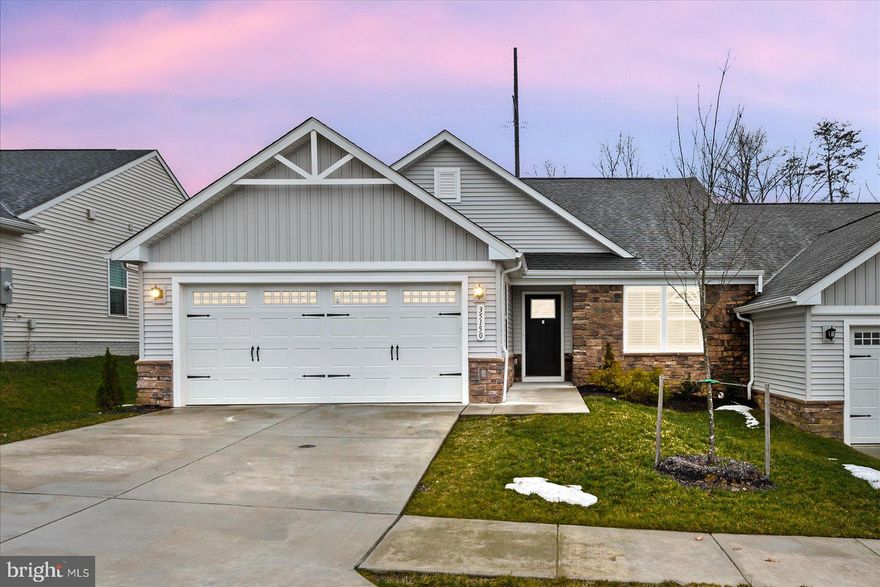 Welcome to 35150 Daisy Way in Locust Grove, Virginia   Come relax in this cozy, comfortable, like new, one level living!! Stylish and easy to maintain vinyl and stone exterior. This Caicos model was built in mid 2024 and is located in Twin Lake Villas of Orange County,  just off Route 3, Germanna Hwy. This rare find, 55+ adult community is just minutes to major shopping and restaurants in the towns of Culpeper and Fredericksburg. Many local shops, golf courses, medical facilities, historic sites, Germanna Community College, wineries and mountains views to explore!  Step inside this 3 bedroom, 2 full baths home of luxury and convenience! Popular, open concept, split bedroom floor plan was designed with easy living in mind.  Gorgeous and modern kitchen,  granite countertops, stainless upgraded energy star appliances and plentiful cabinetry with easy pull out shelves, recessed lighting and a spacious pantry.   Eat at the island-breakfast counter bar or the dining area that is wide open to the great room.  A triple window and glass door bring natural light and lead to the rear covered,  concrete patio. Sit and sip your coffee, tea or dine and enjoy the sounds of nature and your view of the open space.  Watch the grass turn green as you dream and draft your landscaping ideas for spring & summer flowers! Private and spacious primary suite has extra plush carpeting, a ceiling fan, views of the outdoor, open space, and a generous walk in closet. Bright and beautiful bathroom has dual sinks, brushed nickel faucets & knobs, ceramic tile floor, and a large step-in shower with glass doors and built-in seat . Extra linen cabinet conveys if desired.  Laundry room just steps away offer upgraded washer & dryer, neutral tone paint and tiled floor.  2 Bedrooms & full guest bath  at one end of home. Note the plush carpets & soft LVP-luxury vinyl plank flooring, lever set door handles, toggle light switches. Ryan-Smart home technology. 
 Nice concrete driveway and sidewalk to the covered front entry door.  The 2 car garage has some extra depth for a bit of extra storage space.  A must see home, that is clean, dust free and move in ready!!