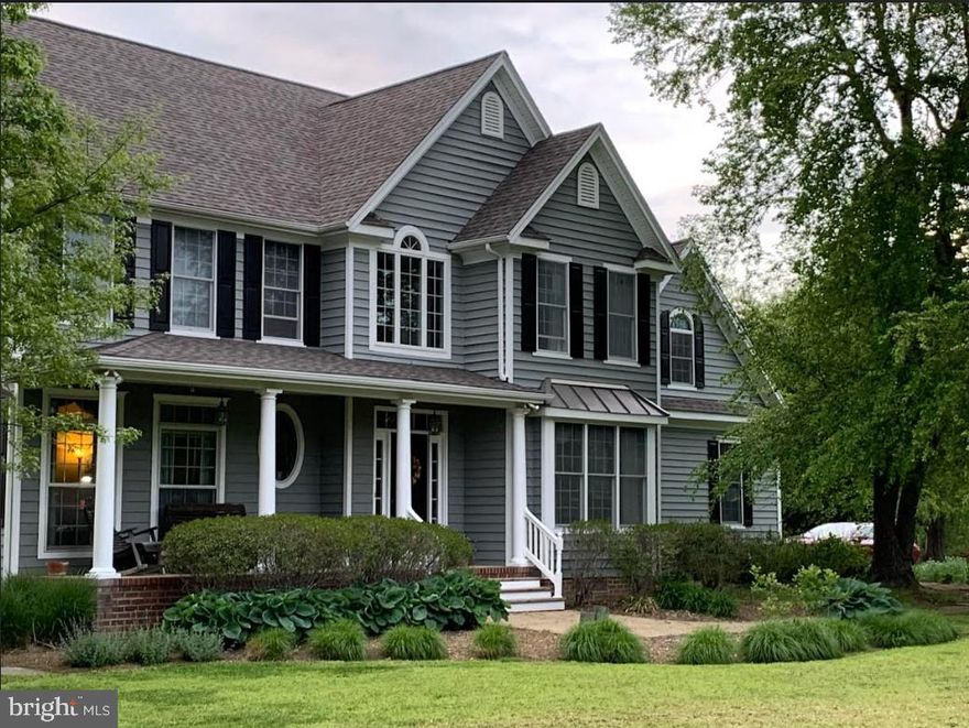 The Southern Maryland Dream Trifecta: Breathtaking Colonial with sweeping views of the Patuxent River, over 200’ of serene waterfront on Wells Cove, and turnkey horse facilities. Welcome to this breathtaking colonial home, perfectly positioned on nearly 10 acres of pristine land, offering unparalleled water views, access and absolute tranquility. This impressive property boasts 4 spacious bedrooms and 2 1/2 bathrooms, featuring modern finishes and thoughtful touches throughout. The primary bedroom features and en suite bath as well as a 2nd custom fireplace. Step inside to discover a meticulously maintained interior, including new flooring, a gourmet kitchen(with custom cabinetry), and a cozy, custom fireplace in the living room—ensuring both style and comfort for everyday living. The home’s generous layout allows for ample space to entertain or unwind, with large windows framing the stunning natural surroundings. Above the 2 1/2 car garage is finished living space for a playroom or possible 5th bedroom. But the home is just the beginning! Outside, you'll find an entertainer’s paradise with extensive hardscaping and a fabulous entertainment area, including covered seating for 10, a Jacuzzi Brand hot tub, a fire pit, and winding walkways that cross over a charming on-property stream. The horse barn is a standout feature, boasting several stalls, including birthing stalls, and a finished upstairs space for storage. Meander through the sprawling, fenced fields to your private dock, complete with electric service. Launch your boat, kayak, or simply enjoy fishing and crabbing right from your backyard. Approximately 8 acres have an invisible fence and one collar will be included with the sale. This is a rare opportunity to own the perfect combination of luxurious living, expansive acreage, and coveted waterfront—the Southern Maryland Dream Trifecta! Don’t miss out on this exceptional property—schedule your private tour today!
***Property is zoned agricultural. If the buyer does not want to maintain that zoning, the buyer is responsible for any costs/fees.