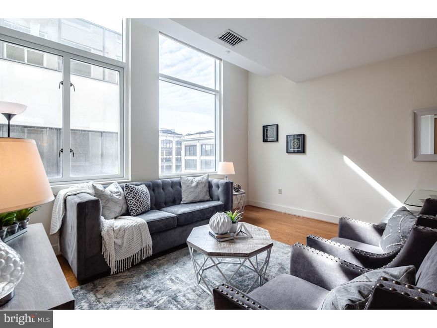 Luxury living at 23rd Street Condominiums near Rittenhouse Square in Center City. You'll love this spacious, fully upgraded condo featuring hardwood flooring and high-end finishes throughout. The impressive kitchen greets upon entry, complete with Viking appliances and an immense peninsula bartop perfect for entertaining or just enjoying a nice cup of coffee. In the living room beyond, the south-facing window with custom blinds floods the space with sunlight and provides amazing street-level and cityscape views. A convenient powder room and a storage/coat closet round out the living area. The sizable master suite includes his and her closets and an en suite luxury bath with soaking tub and separate walk-in shower. The building features all the conveniences to make Center City living easy with in-unit laundry, secured entry, doorman, and an lease-able parking space in the attached garage, not to mention the common garden and courtyard in addition to the spacious lobby. Nearby to UPenn, Drexel, Hahnemann, CHOP and moments to University City! Immediately surrounding the building is the world class dining and shopping of Rittenhouse Square and Center City Philadelphia. Schedule your showing today!