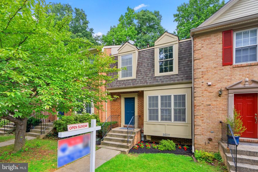 Urban living surrounded by an environmental oasis and just a short stroll to Metro, shopping and all of your favorites! Three finished levels, walkout basement, fenced rear yard, 3/4 bedrooms, 3.5 baths, upper and lower decks, patio and  so much more! Freshly painted and immaculate throughout, this home is turnkey and ready for your decorating ideas. Forest bath in the mornings in the wooded community garden and enjoy the sights and sounds of nature as you sit on your deck while dining alfresco! Vaulted ceilings in the owner's suite, woodburning fireplace in the recreation room, lots of storage, assigned parking plus so much more. Not to be missed, this home is truly a perfect 10! Low HOA dues too as the community is owner managed.