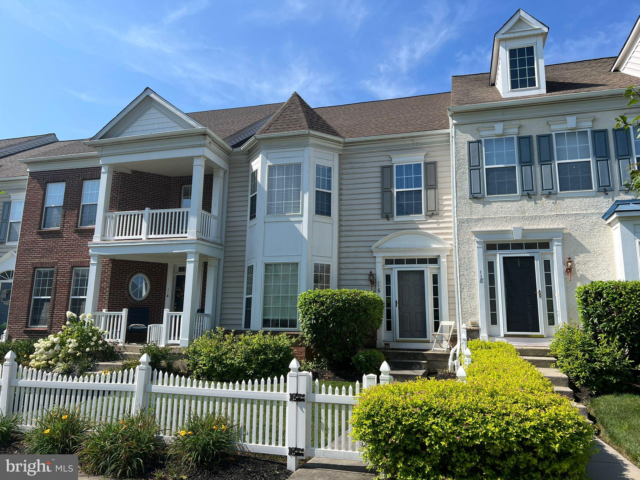 Welcome to this very charming 2 Bedroom townhome in Fountainville's popular Bedminster Square, a 107-acre community featuring single family and luxury townhomes. A beautiful, very well maintained by the owners. Ready for loving renters to adore and enjoy!
A picket fenced walkway lined with colorful lily's leads to unit. Inside the bright and sunny foyer reveals the front to back open concept perfect for entertaining and every day living. The first floor features wood flooring throughout, custom crown molding, an open floor plan, a large Kitchen,Living and 2-story Family Room with marble surround fireplace and sliders to the rear patio. 9' ceilings, Main Floor Laundry Room, attached 1 car rear entry Garage. Upstairs is the Master Bedroom with trey ceiling, ceiling fan, large sunlit walk in closet. Master Bath features a dual vanity, large soaking tub, separate shower and water closet for privacy. Bedroom 2 and full bath complete the second floor. Neutral greige finishes throughout make this house move in ready. Full basement and 1-car garage round out this delightful home.The lower level provides extra storage and is ready for finishing, Bedminster Square residents enjoy miles of walking trails, multiple playgrounds, tennis courts and easy access to everything the area has to offer. Enjoy a low maintenance lifestyle - minutes to Downtown Doylestown and an easy commute to Lehigh Valley.